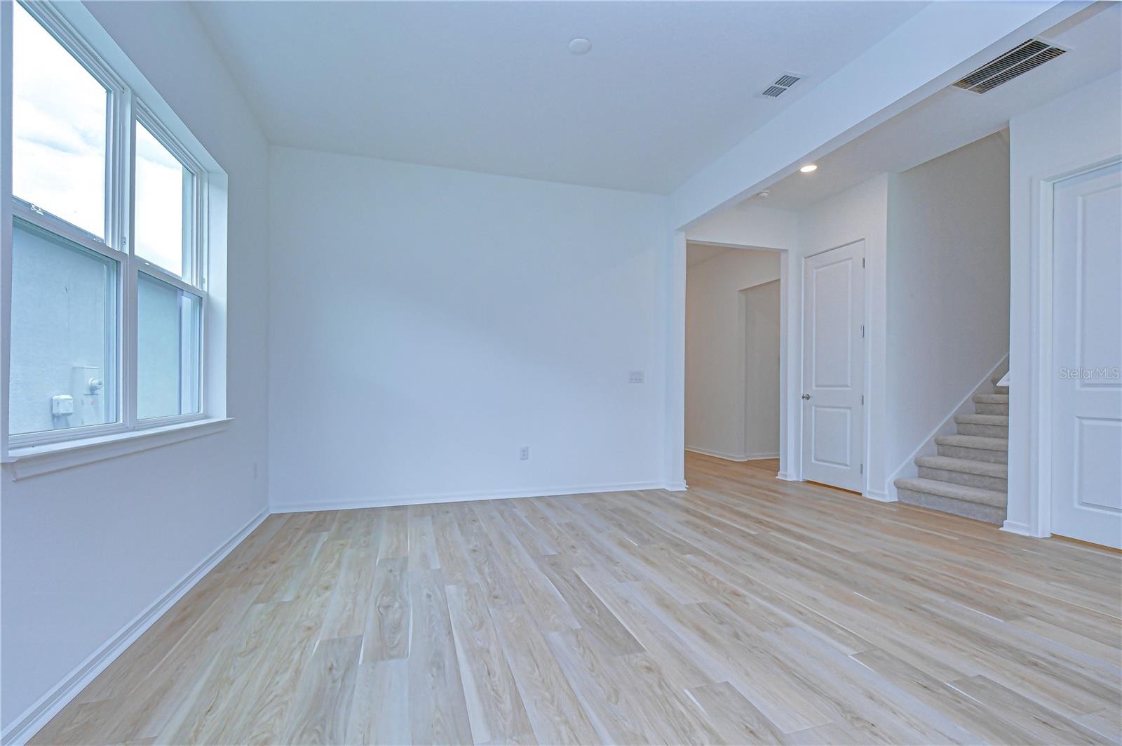 Luxury wood-look vinyl flooring throughout main areas