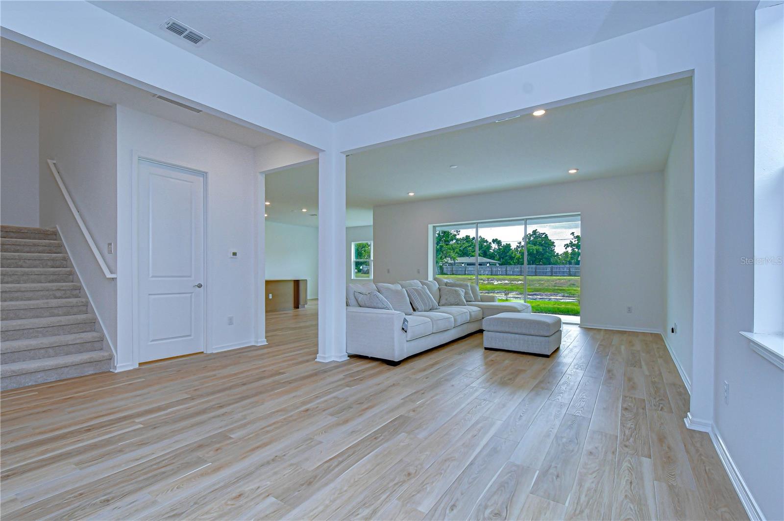 Seamless connection between living, dining, and kitchen