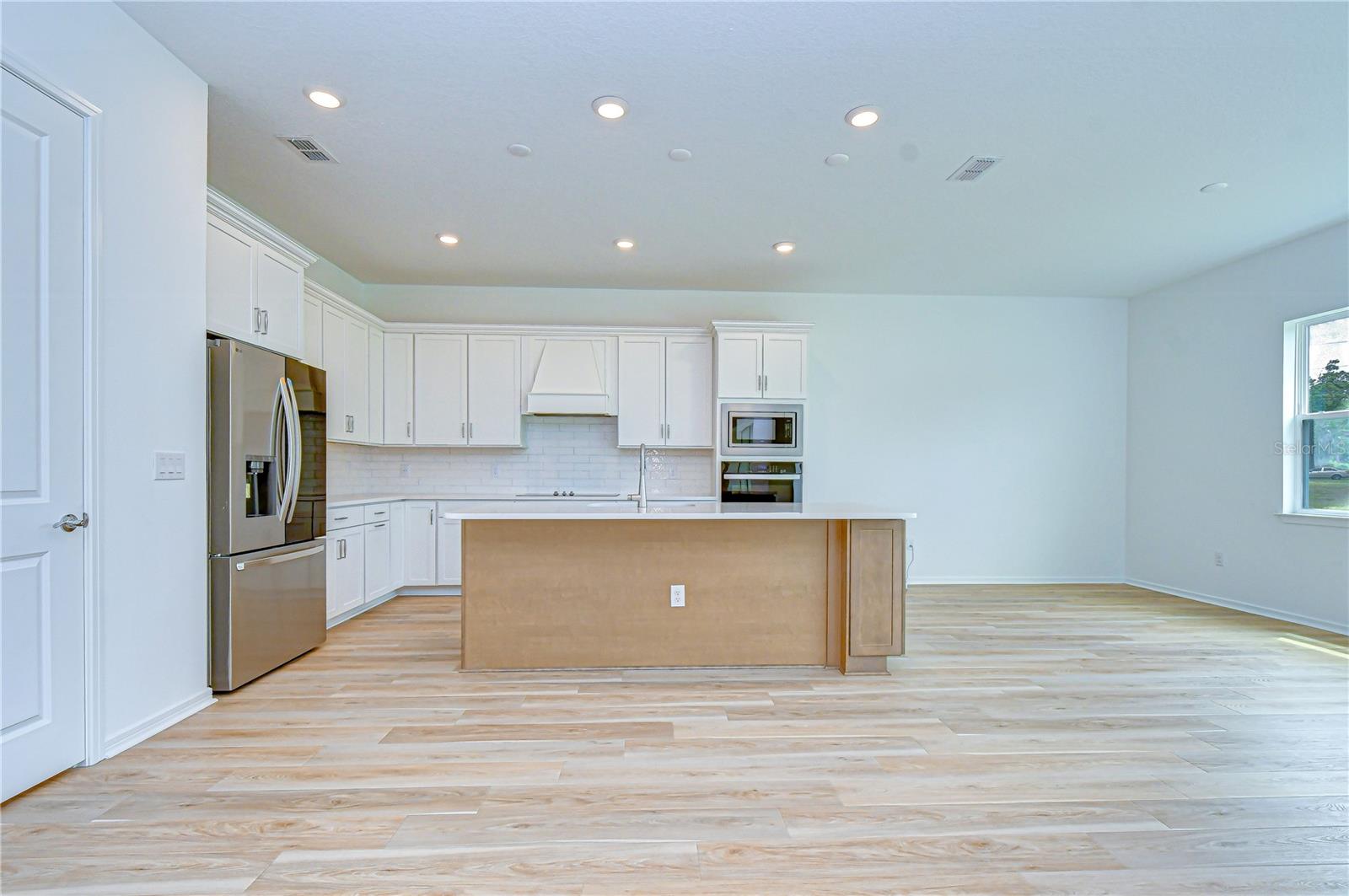 Gourmet kitchen as the centerpiece of the home