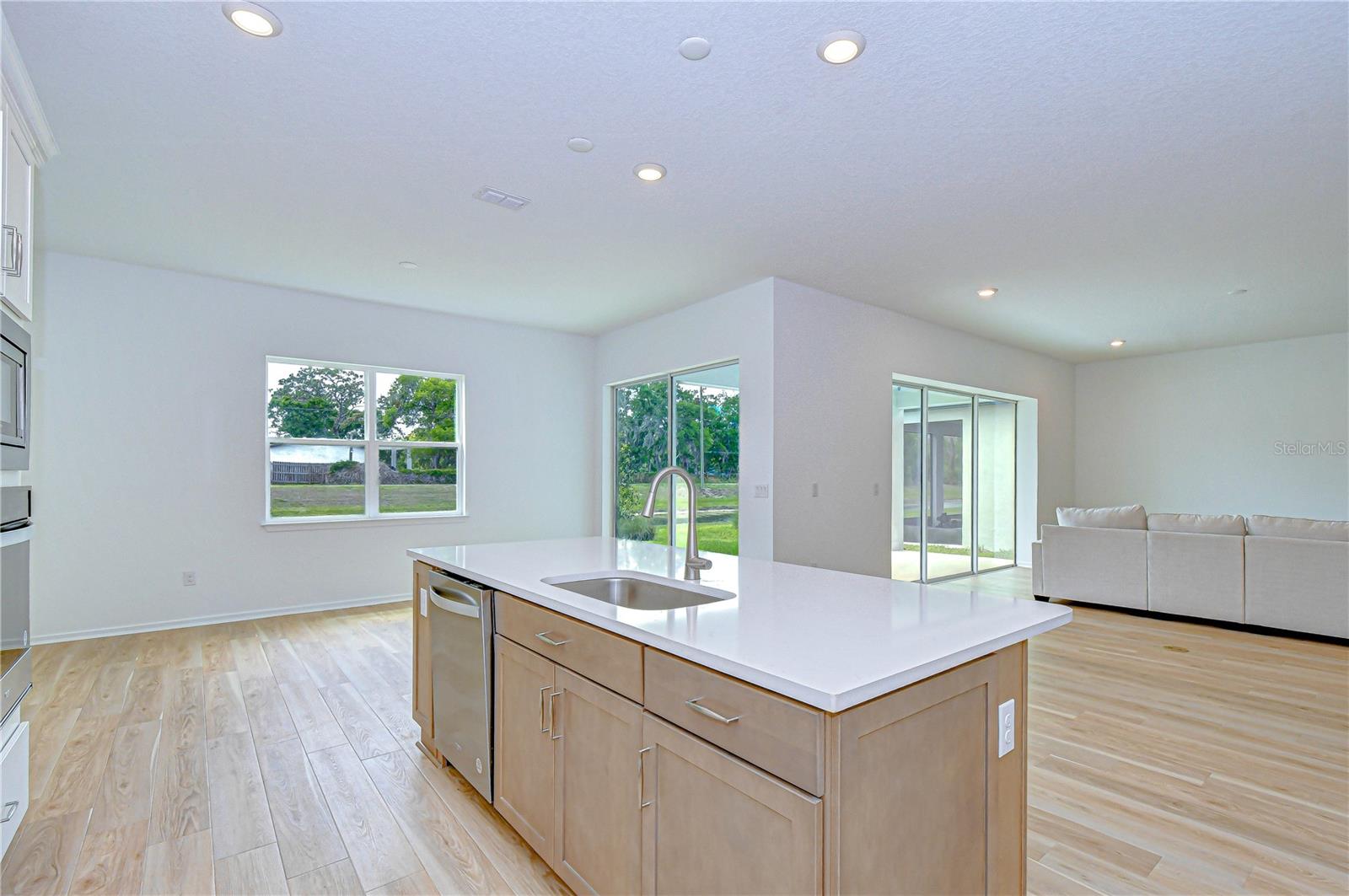Large island with quill cabinetry and seating space