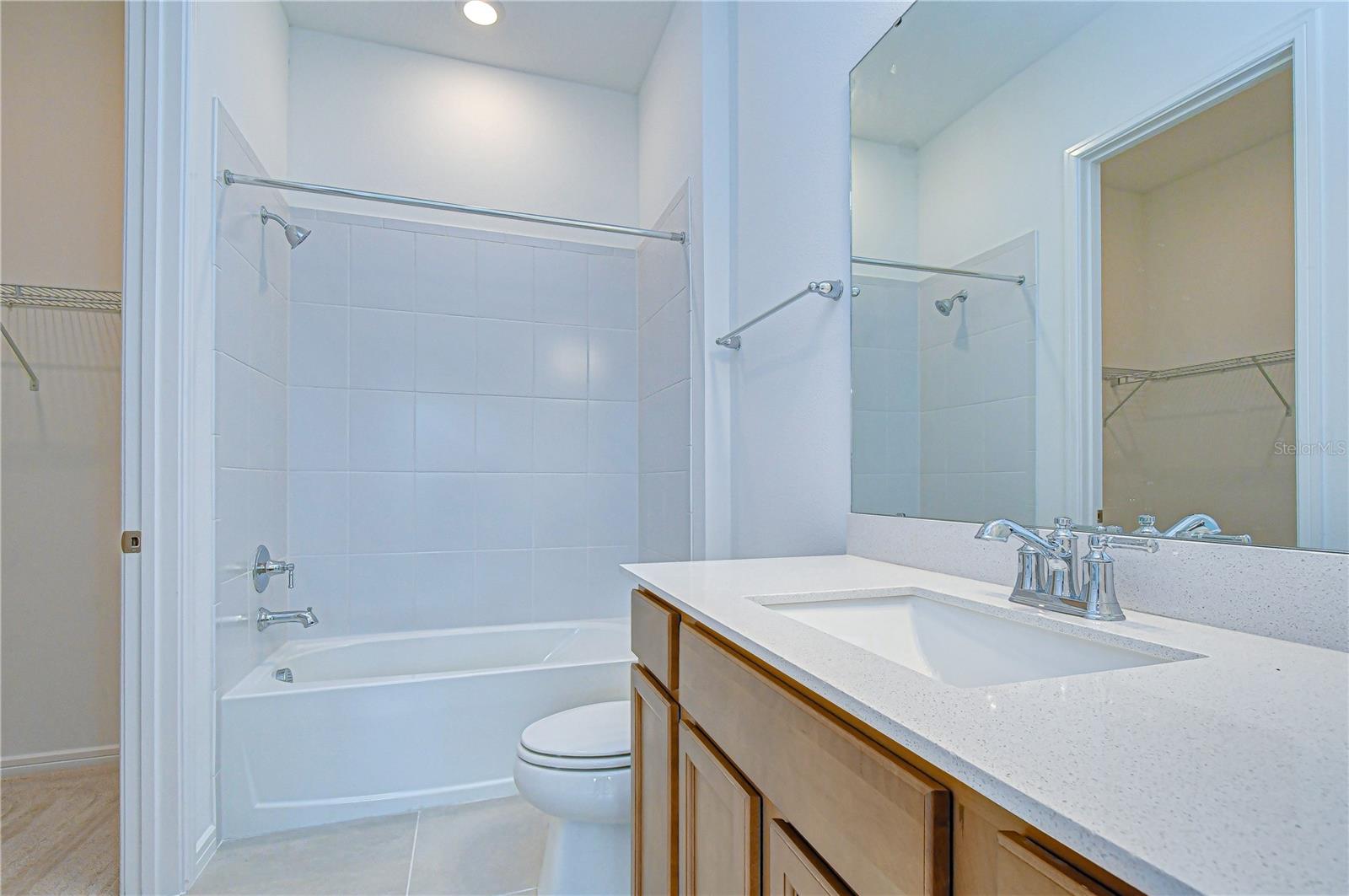 Bathroom with access to walk-in closet