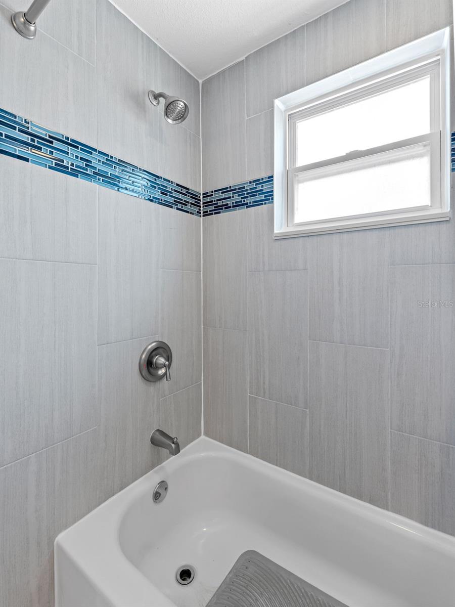 Bathtub shower combo in bathroom