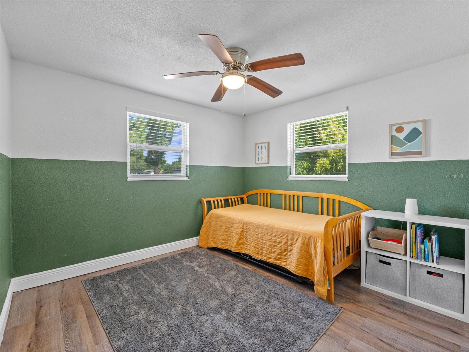 Bedroom 2 is spacious and clean with vinyl plank flooring