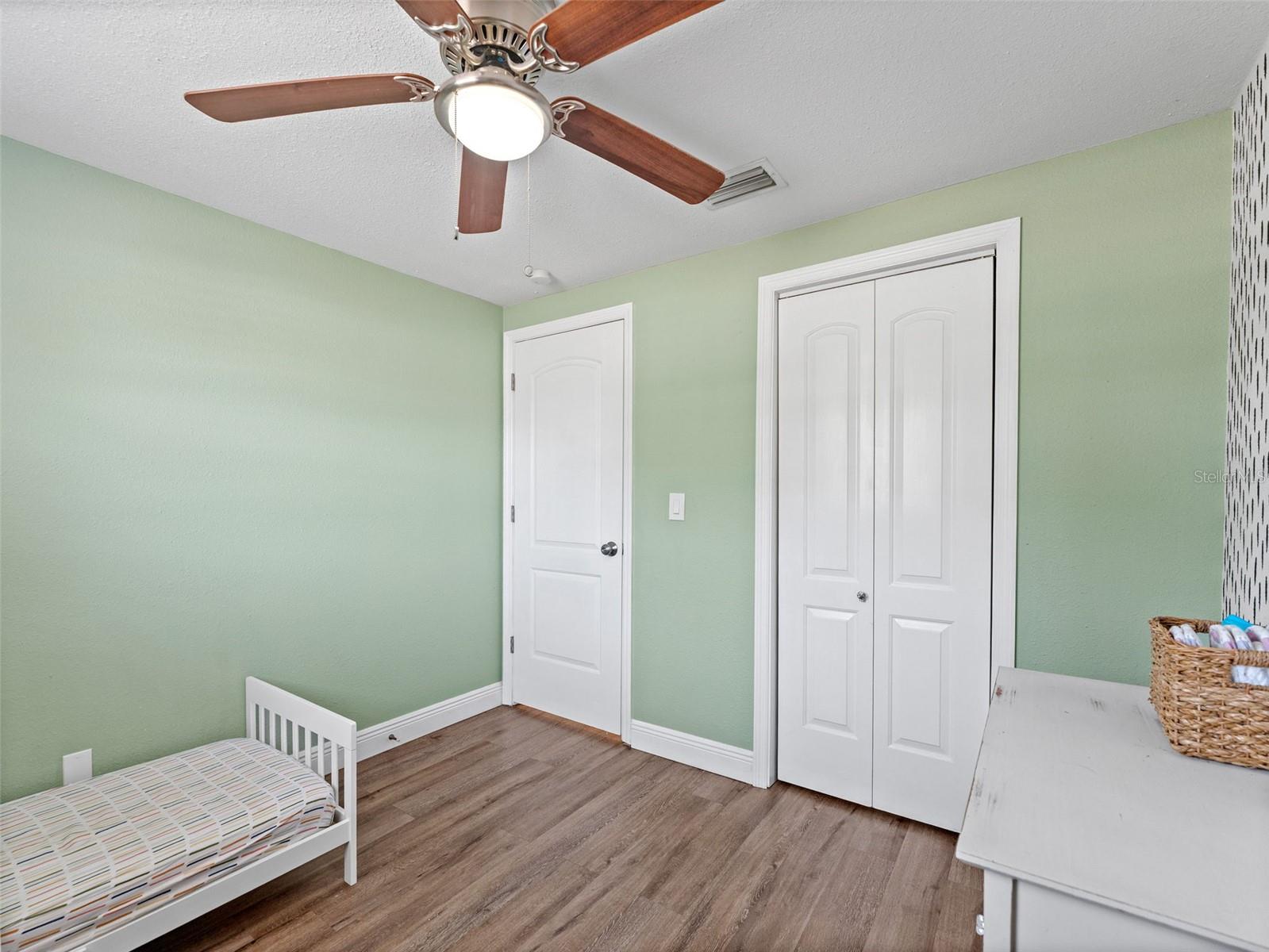 Bedroom 3 features a larger closet with custom built in shelves and storage