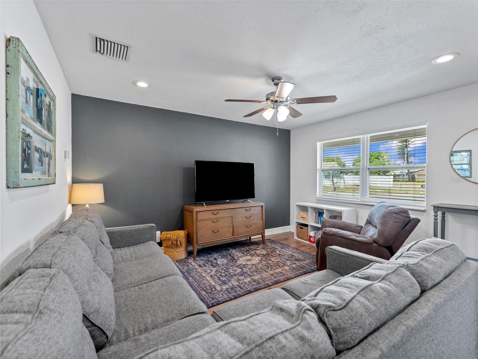 LED can lights, updated ceiling fan and lots of natural light
