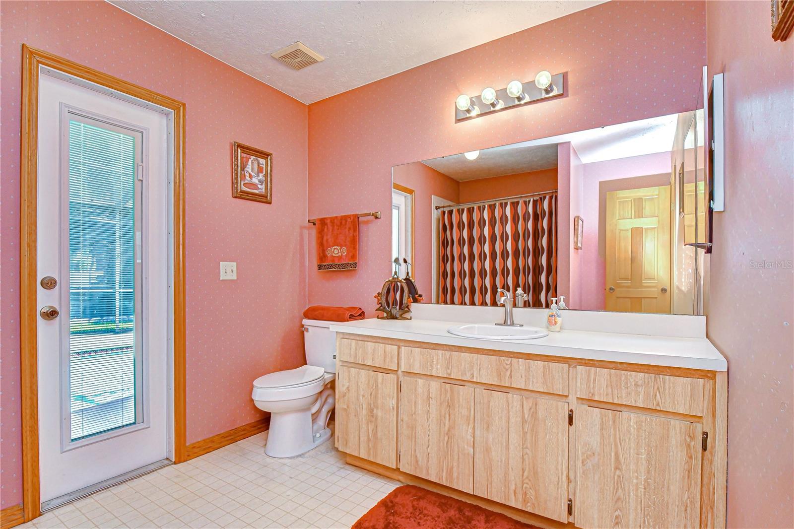 Shared bath with direct pool access for functionality