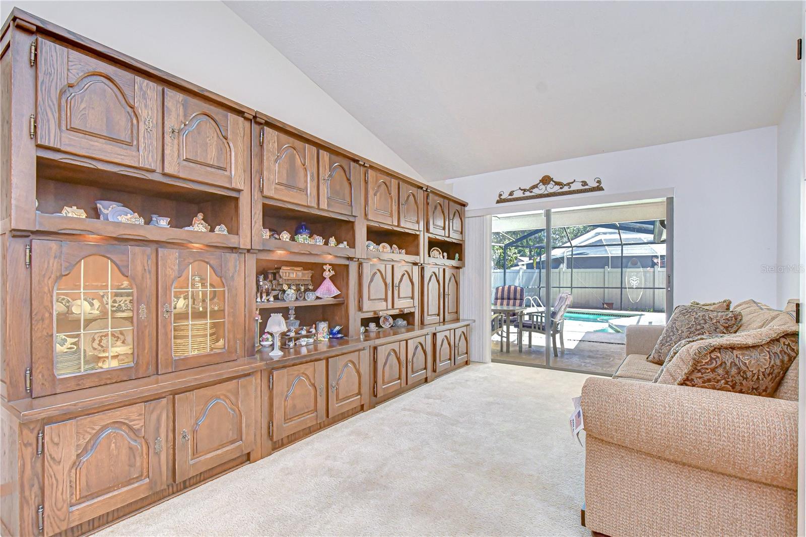 Formal living space with serene pool views