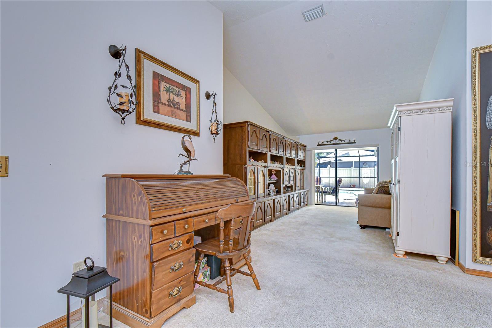 Formal living space with serene pool views