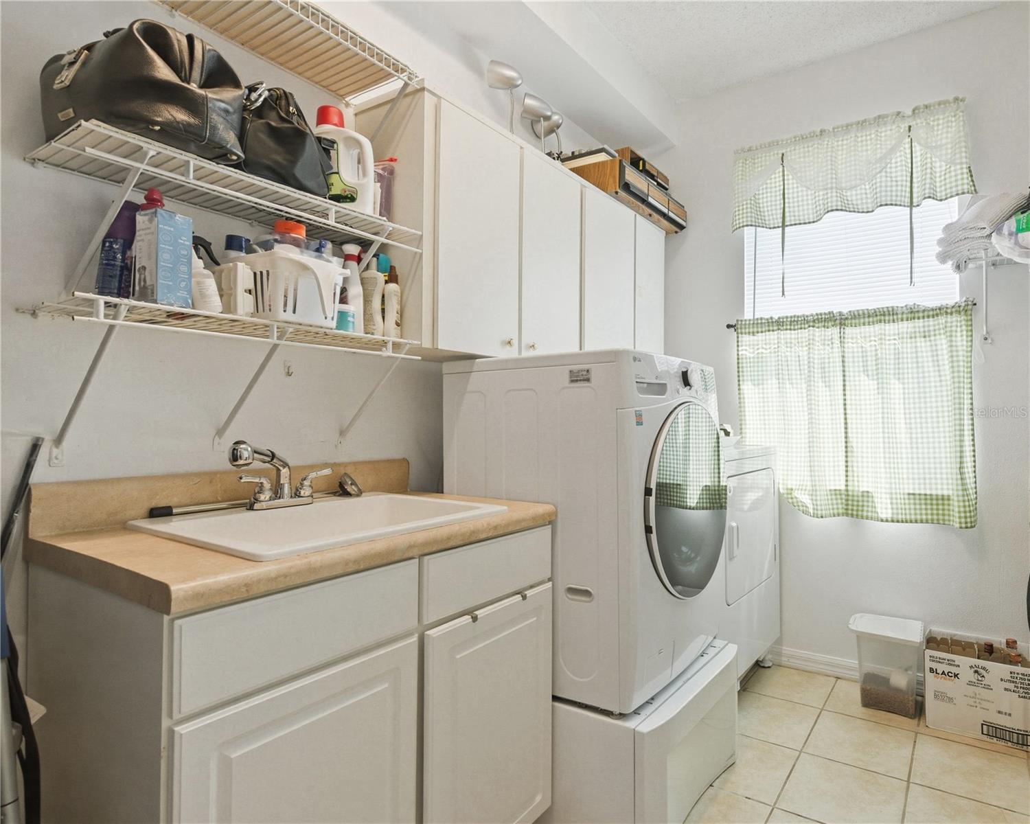 Laundry Room with sink and storage