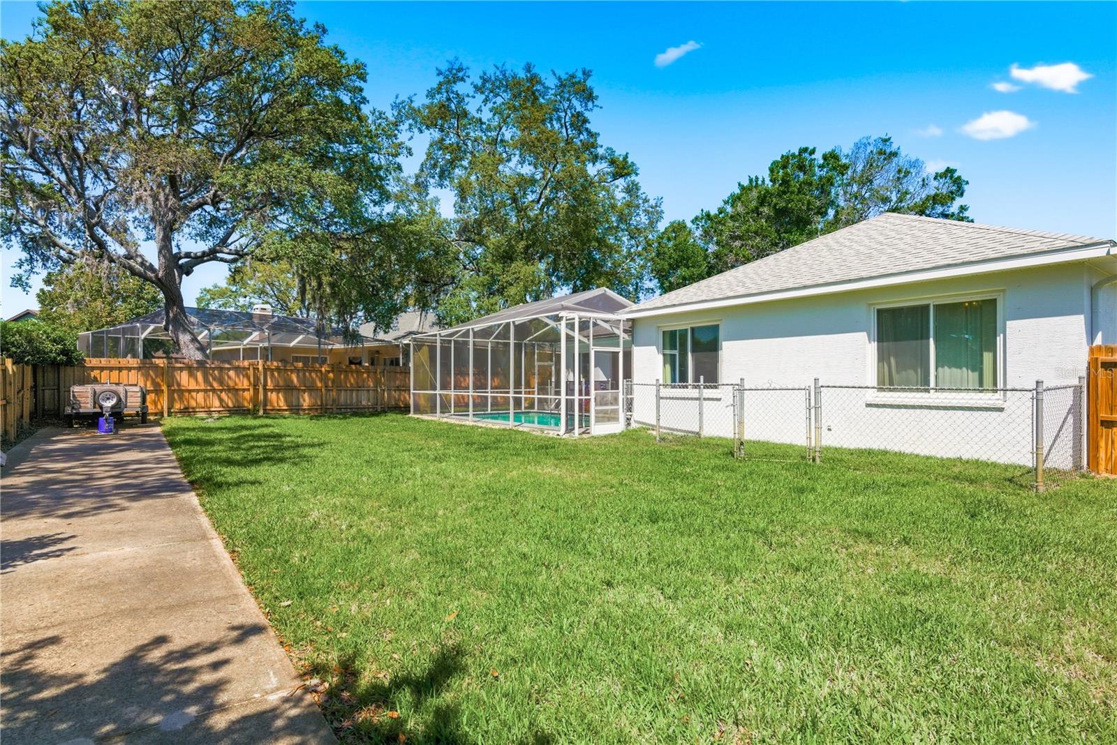 Back yard has paved space for multiple options