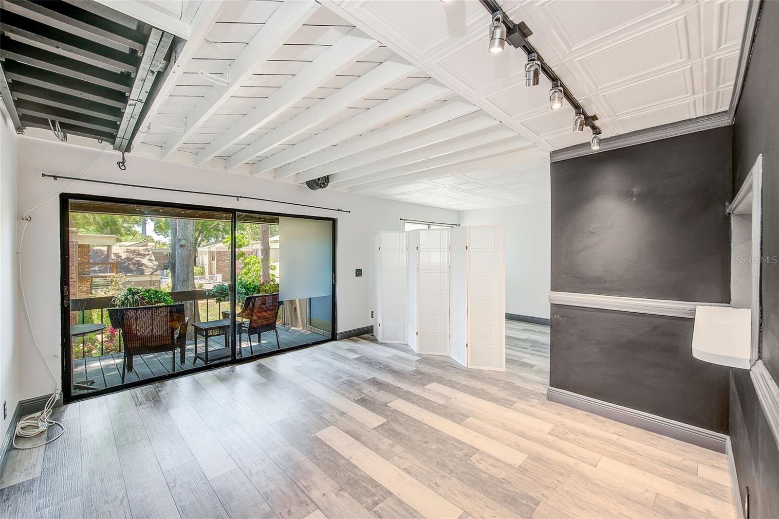 LIVING TO DINING TO PATIO TO BEDROOM AREA