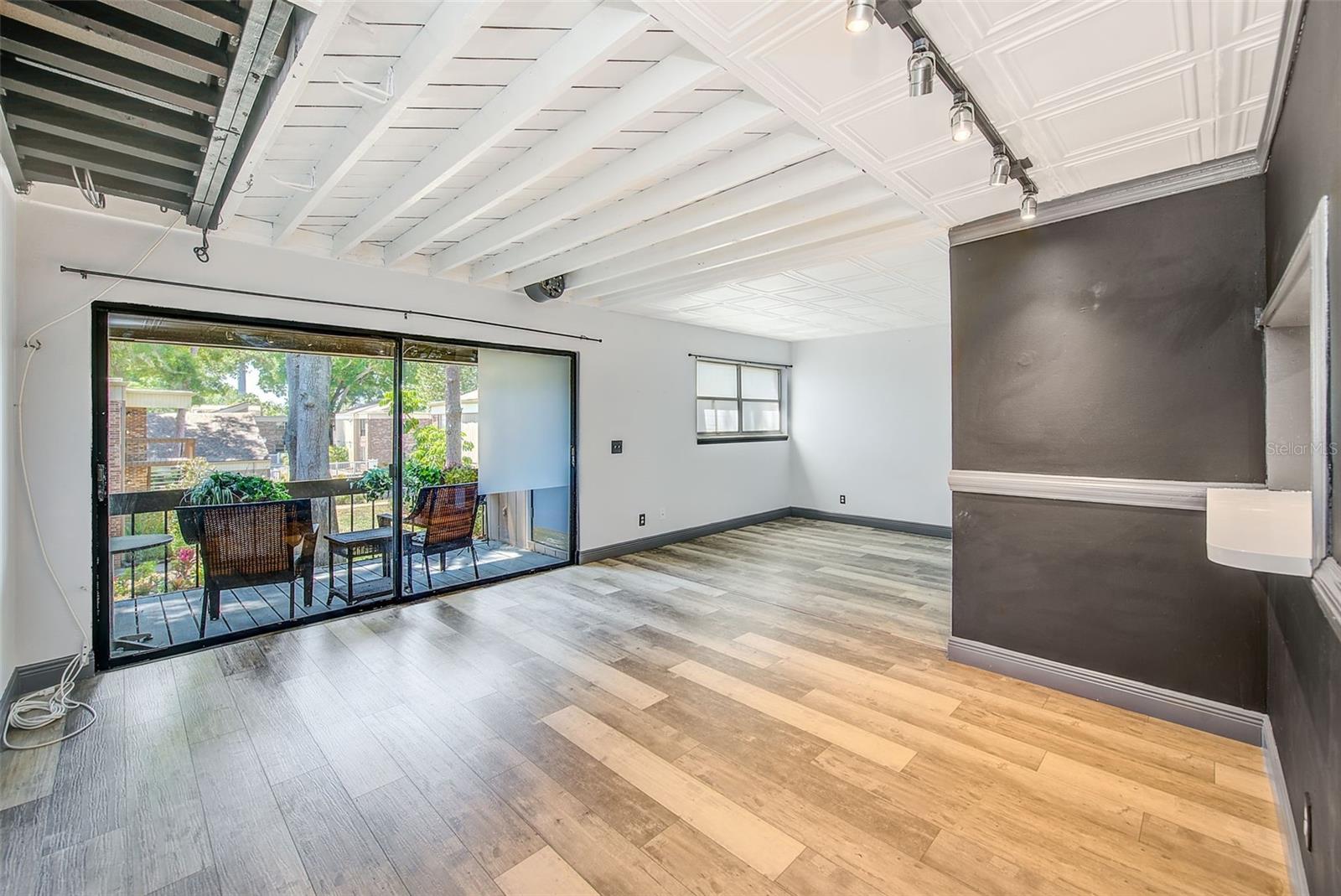 LIVING TO DINING TO PATIO TO BEDROOM AREA