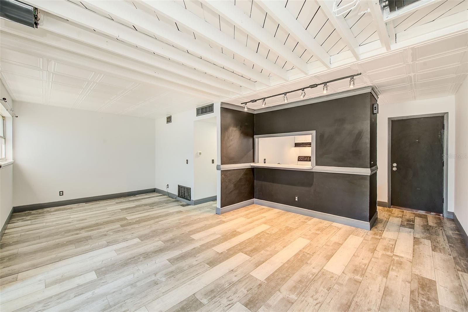 LIVING TO DINING TO BEDROOM AREA