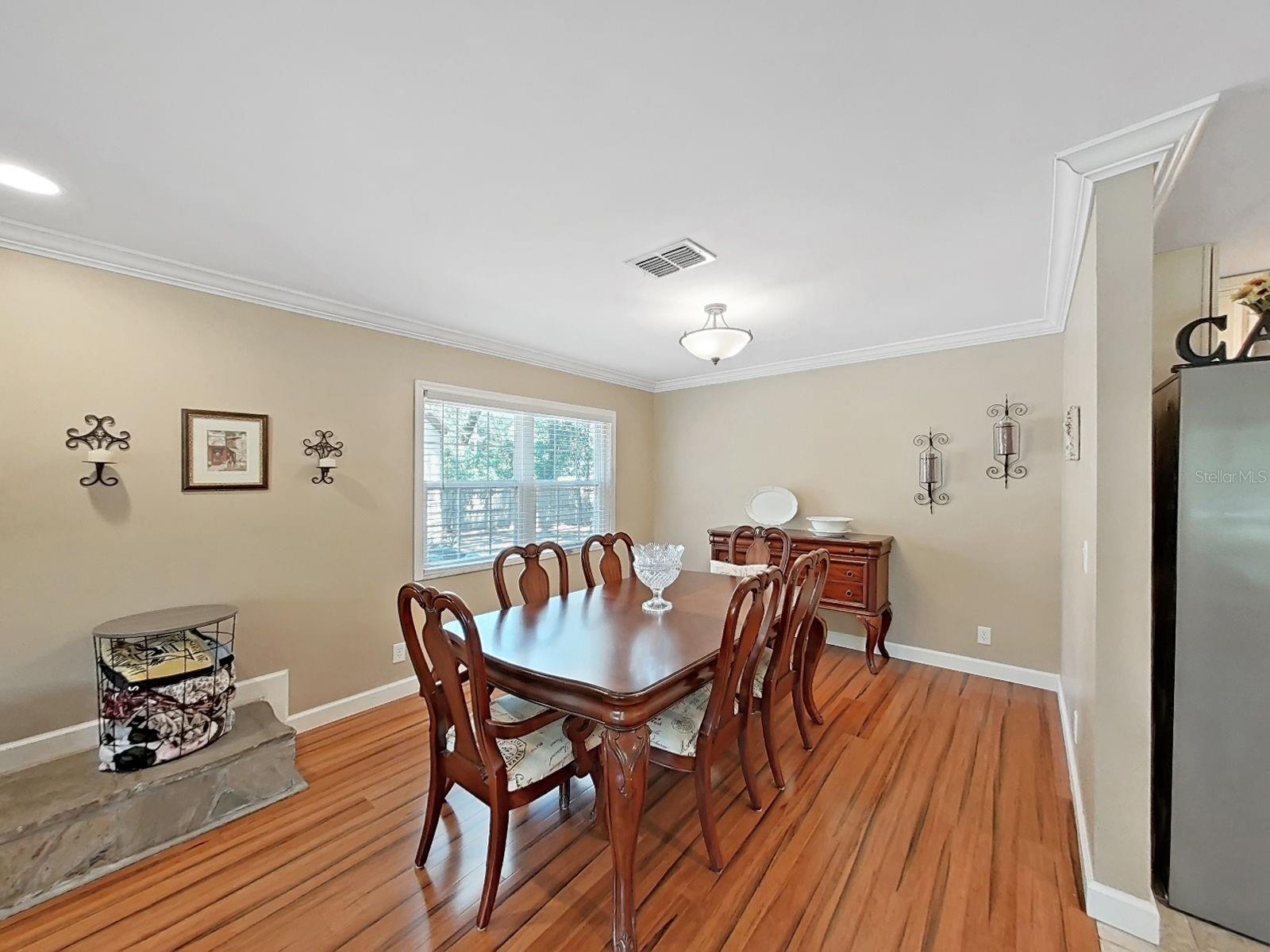 Large dining room with window view & plenty of space to host holiday dinners & special gatherings.