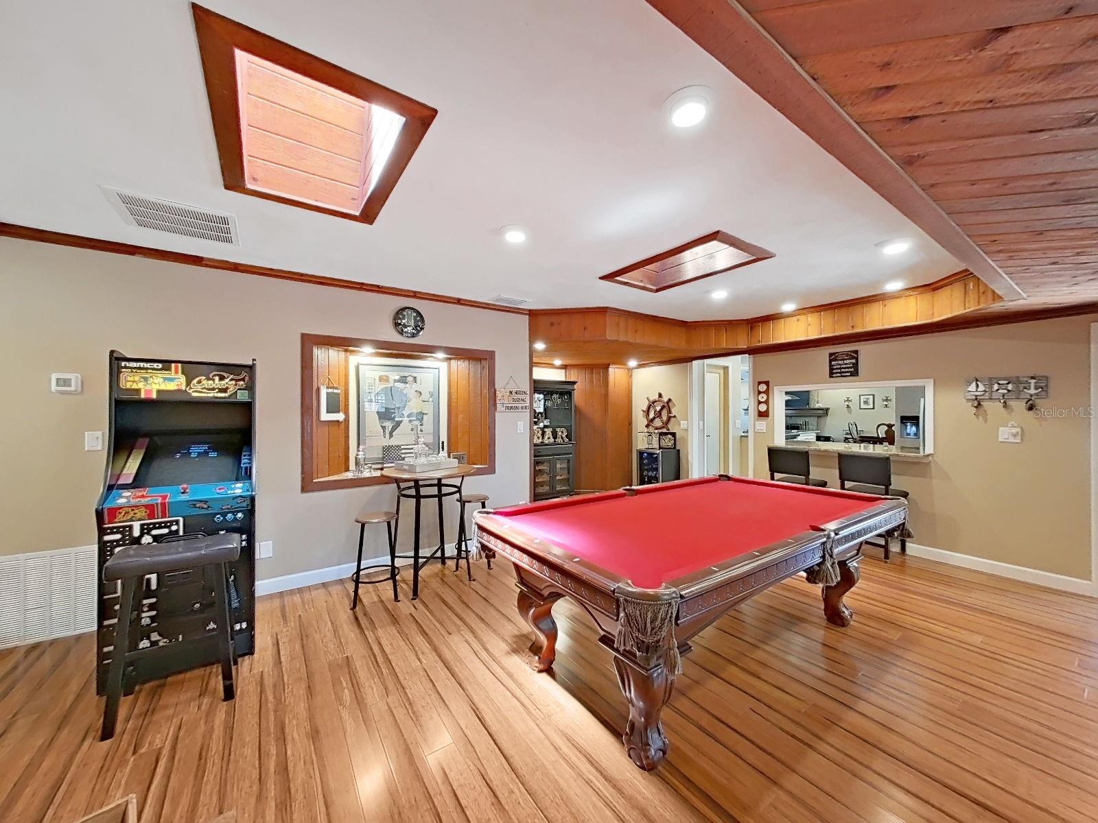 Bonus Room with skylights, recessed lighting, nook, and pass-through bar to kitchen- every detail of this space was designed with fun in mind!