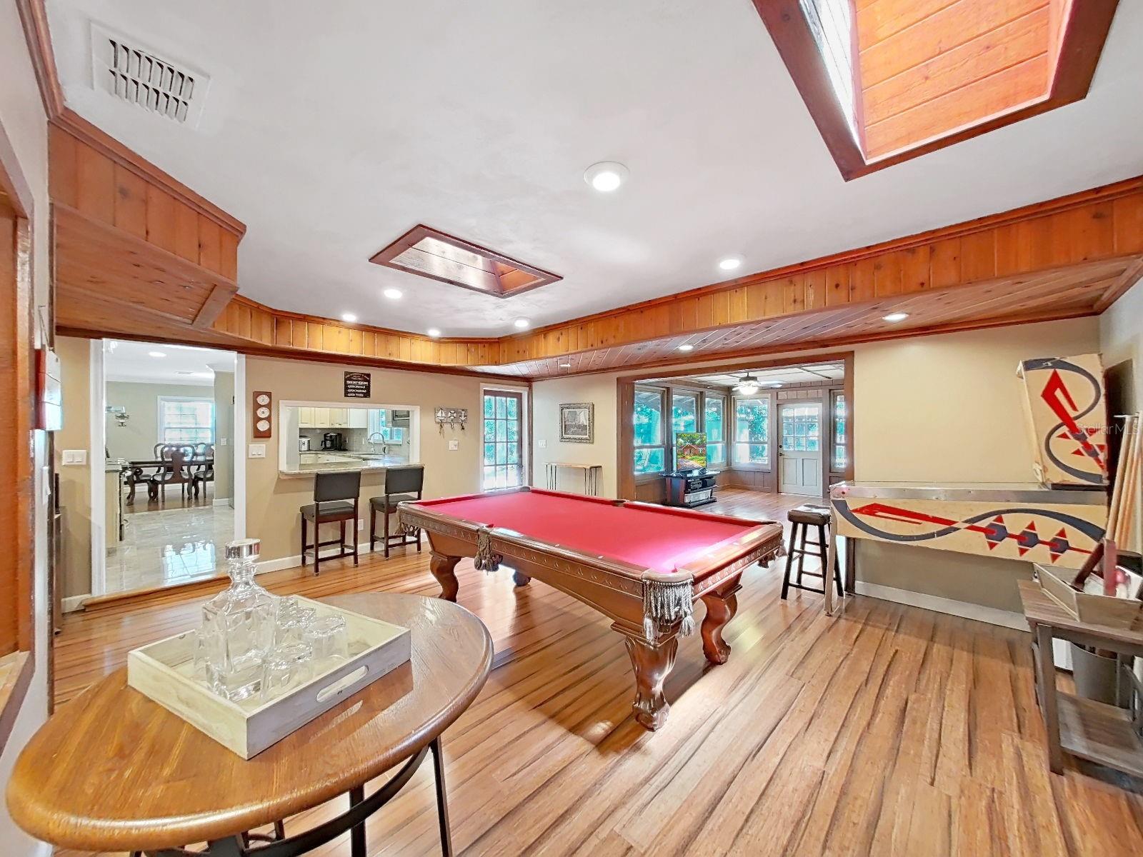 Incredible Bonus Game Room with pool table, pass-through bar, recessed lighting & skylights. Entertainment central for all!