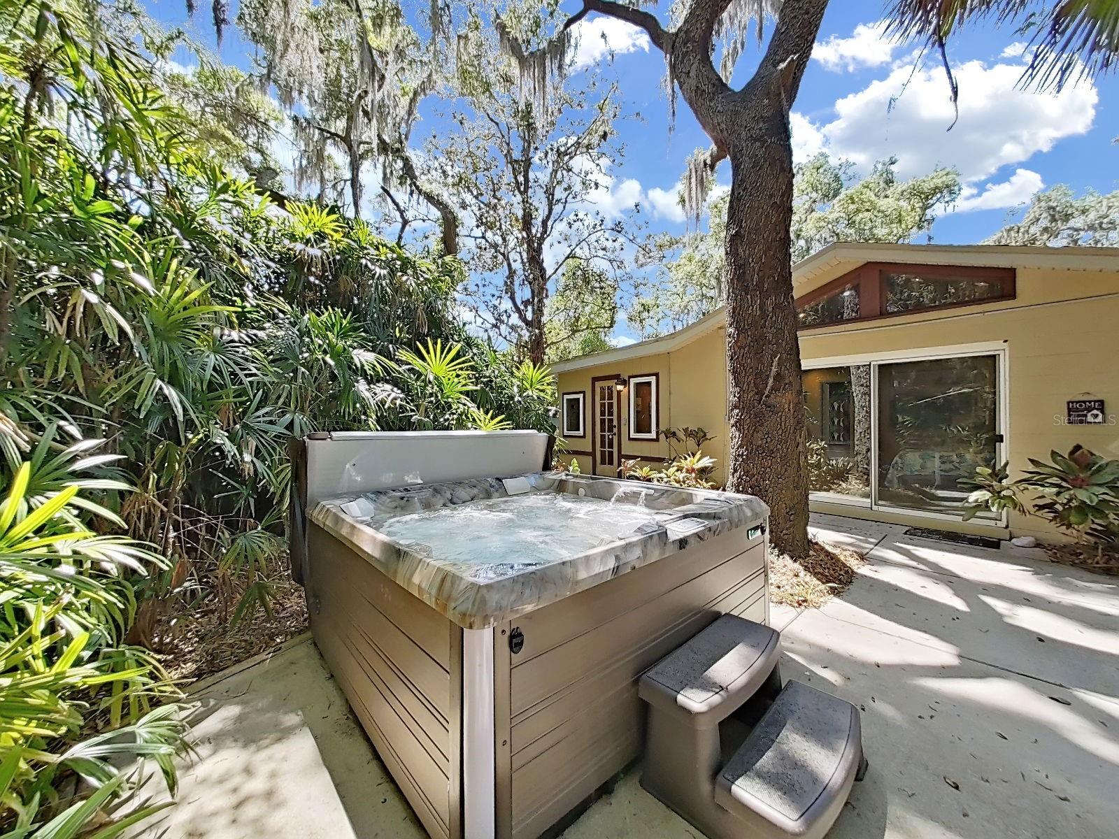 Relax & unwind in your private jacuzzi, nestled among lush tropical landscape- your own outdoor escape right off the back of the home.