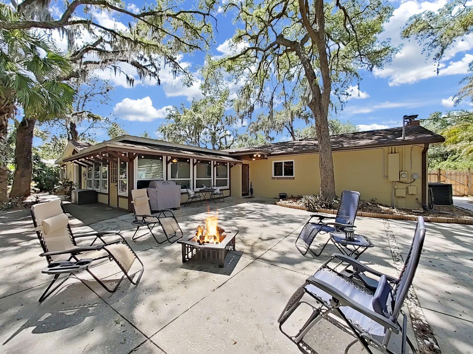 Large outdoor living patio! Catch the warmth of the sun by day. Gather with friends in the evening!