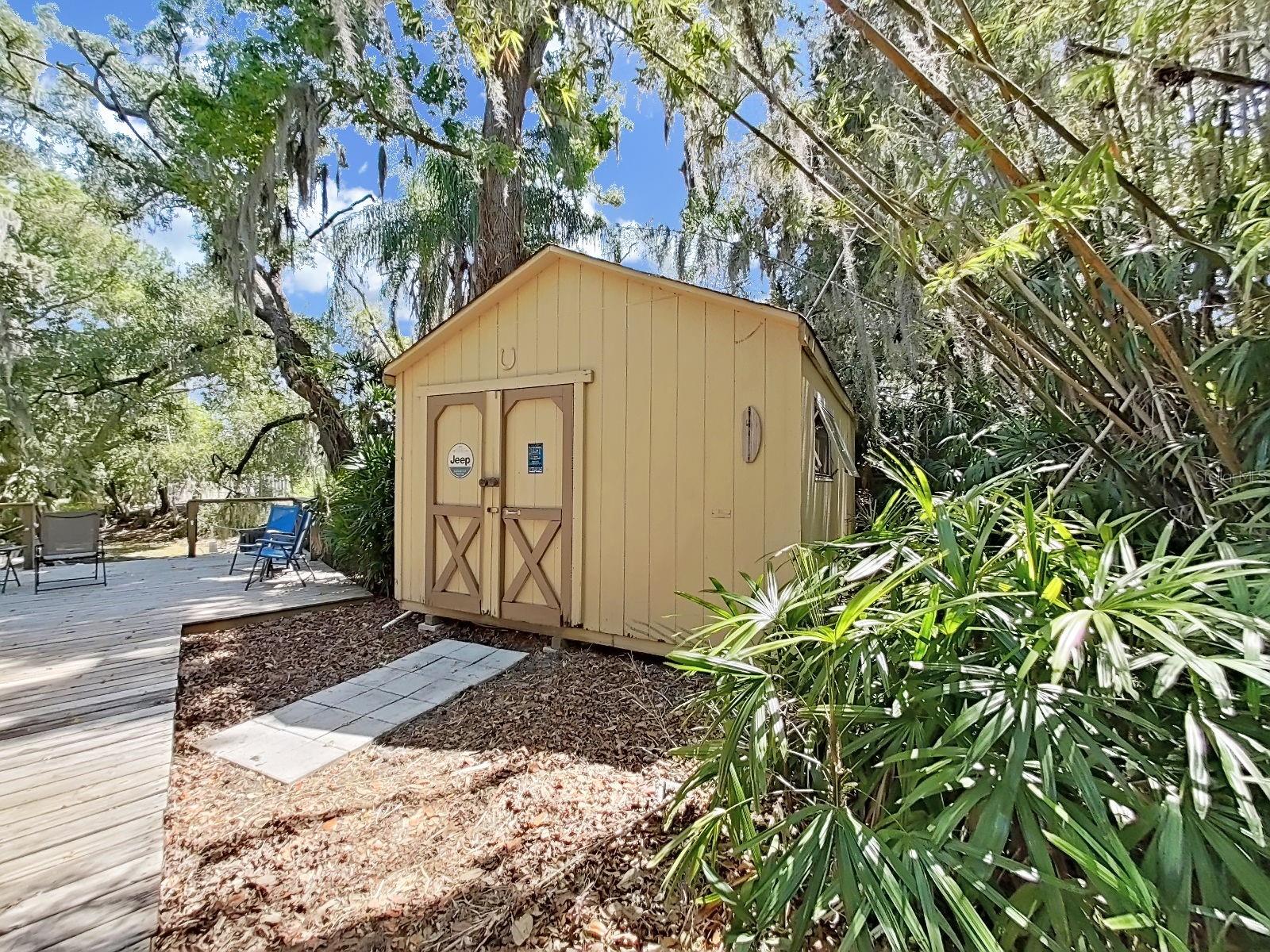 Insulated with window A/C unit. So many opportunities! This spacious shed is the perfect flex space & escape for hobbies or storage.