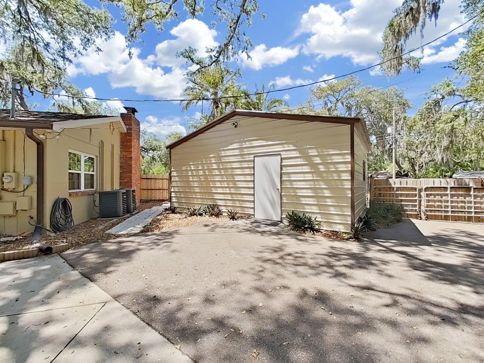 Oversized detached 2-Car Garage with a rear entry door, located just steps from the main residence.