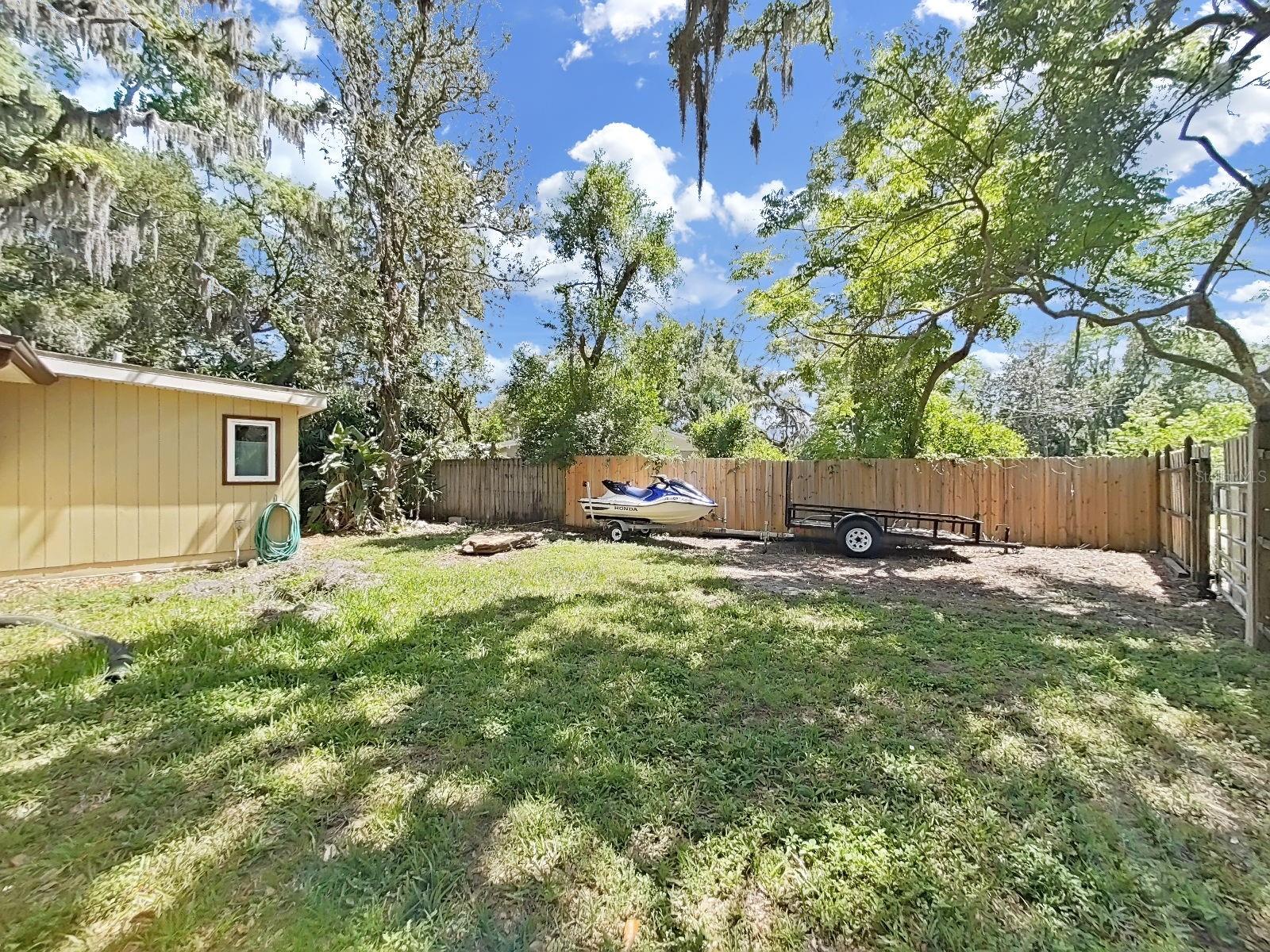 Bring your outdoor toys! Large fenced in side yard with access gate, perfect for boat, jet ski, trailer, or RV storage!