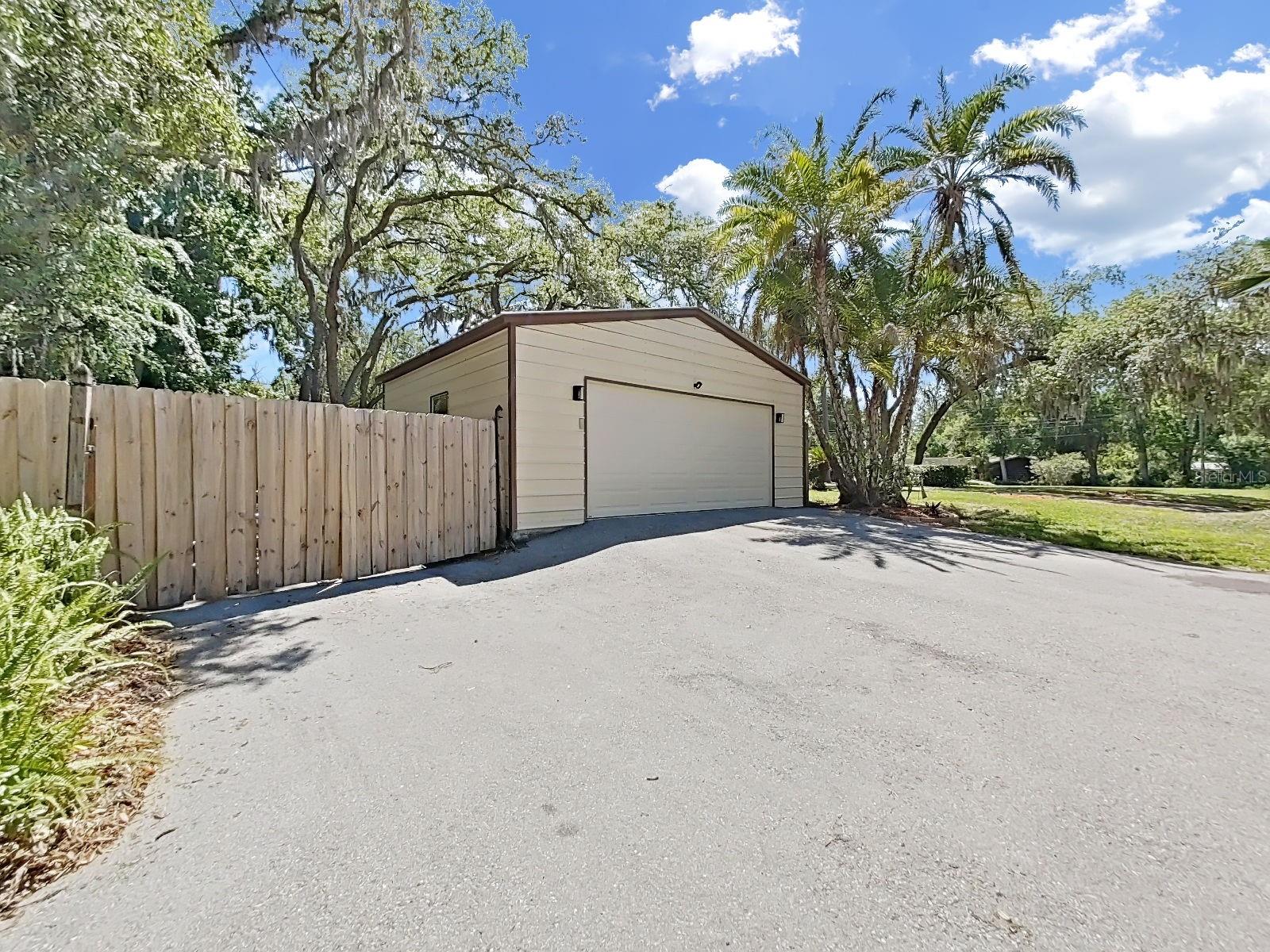 Oversized 2-Car detached Garage with door opener and expansive paved driveway. Plenty of room for boats, RVs, or extra vehicles.