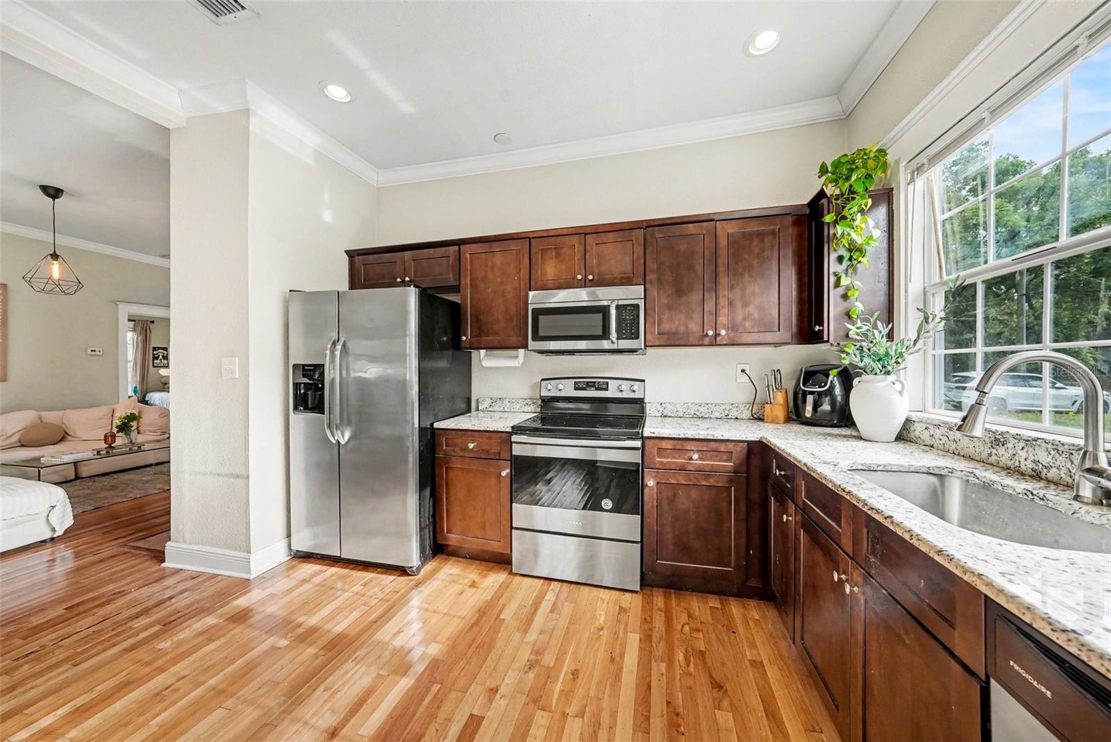 Kitchen opening to living space, ideal for everyday living and entertaining.