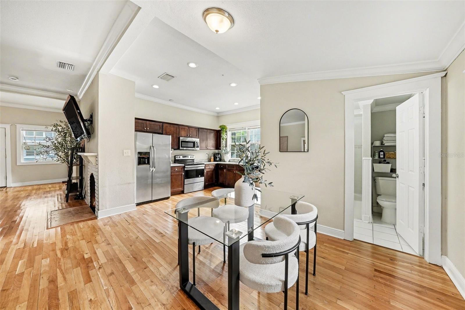 Additional view of dining area with natural flow into kitchen.
