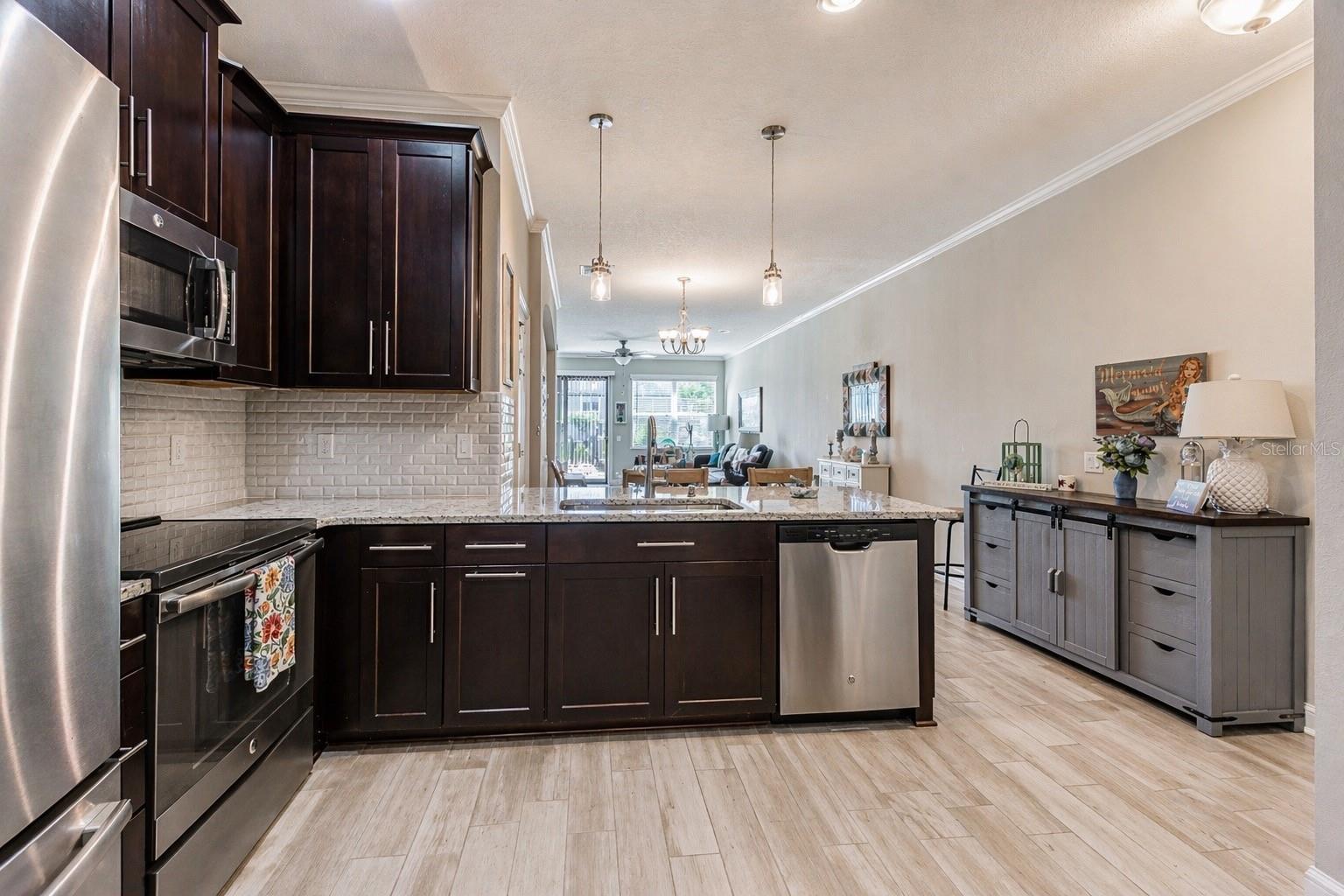 Kitchen with custom tile backsplash.