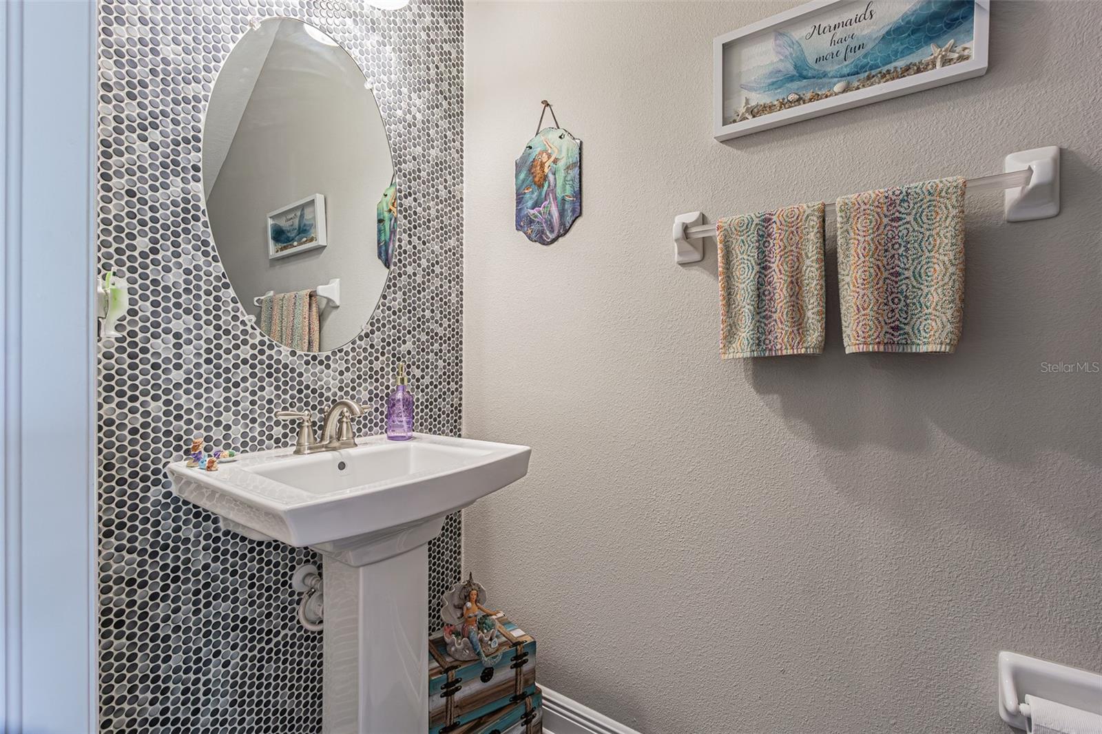 Powder Bath with custom tile accent wall.