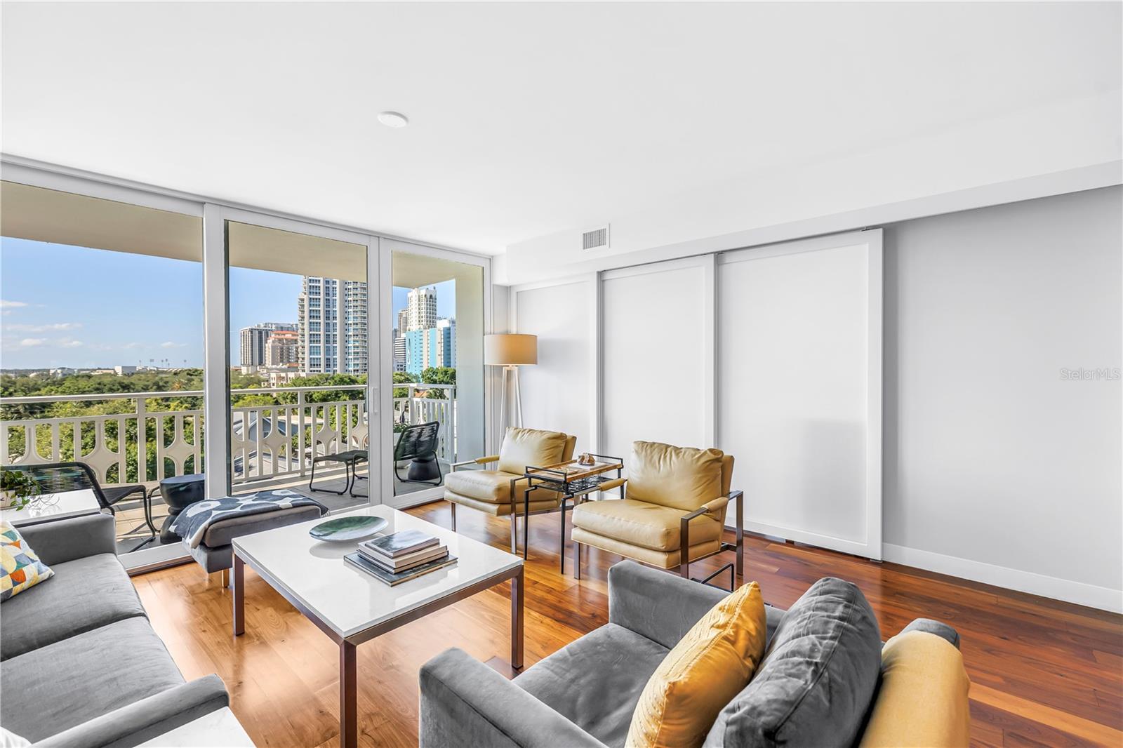 Living room with Raydoor trackless sliding wall system closed to the 2nd bedroom