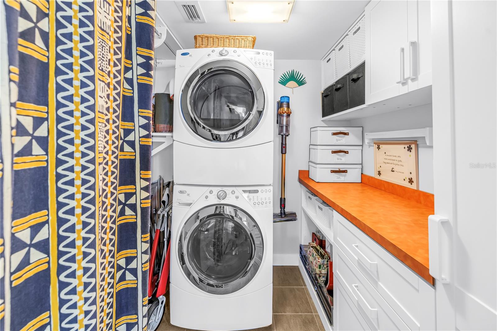 Laundry room with more storage space and plenty of counter space