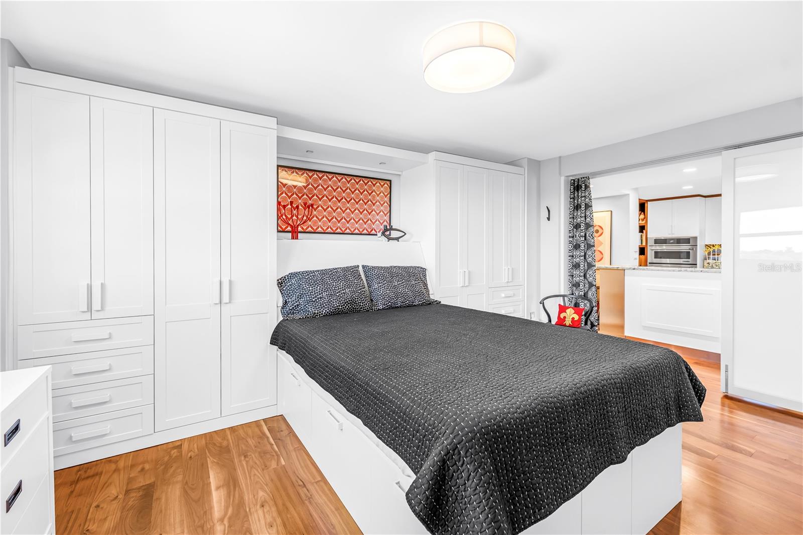 Raydoor trackless sliding wall system is partially open in this photo