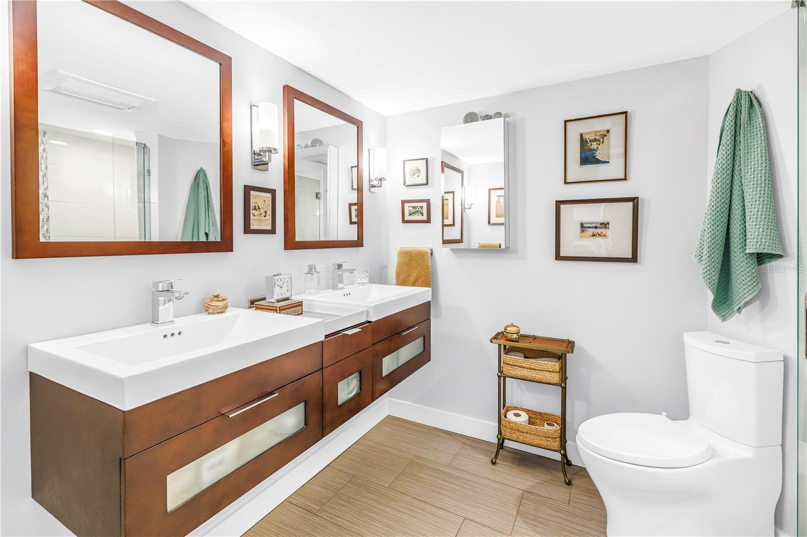 Primary bathroom with double sinks and shower