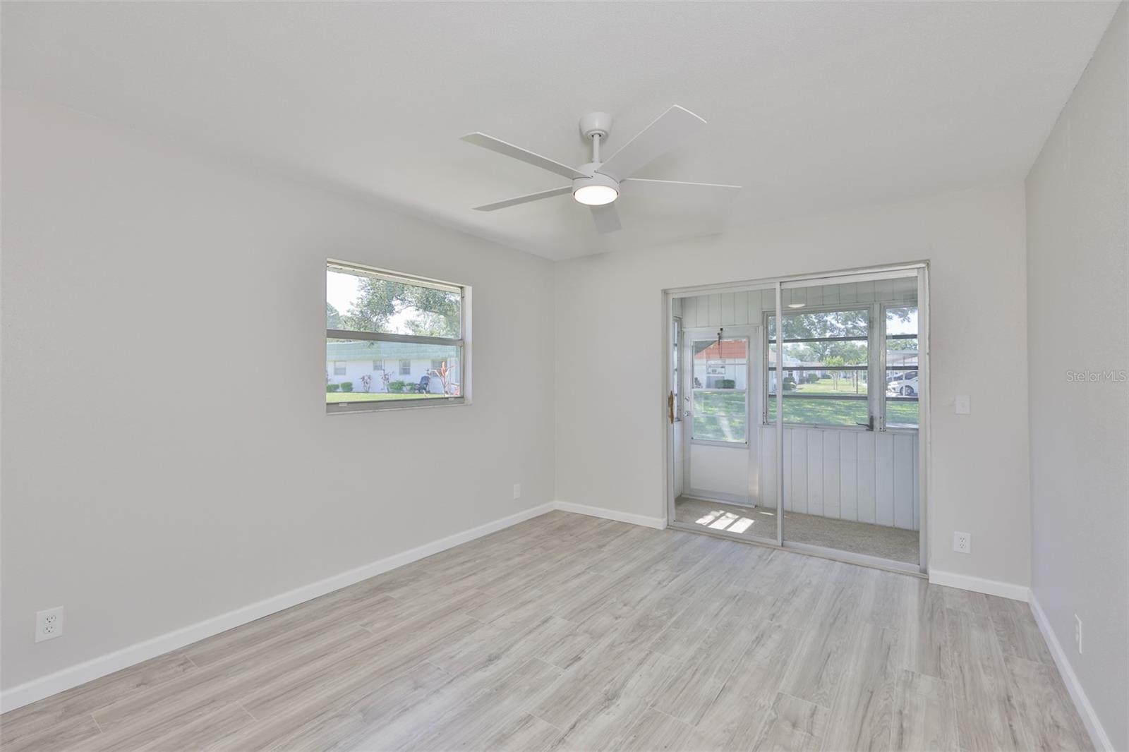 2nd bedroom with sliding glass doors leading to the lanai