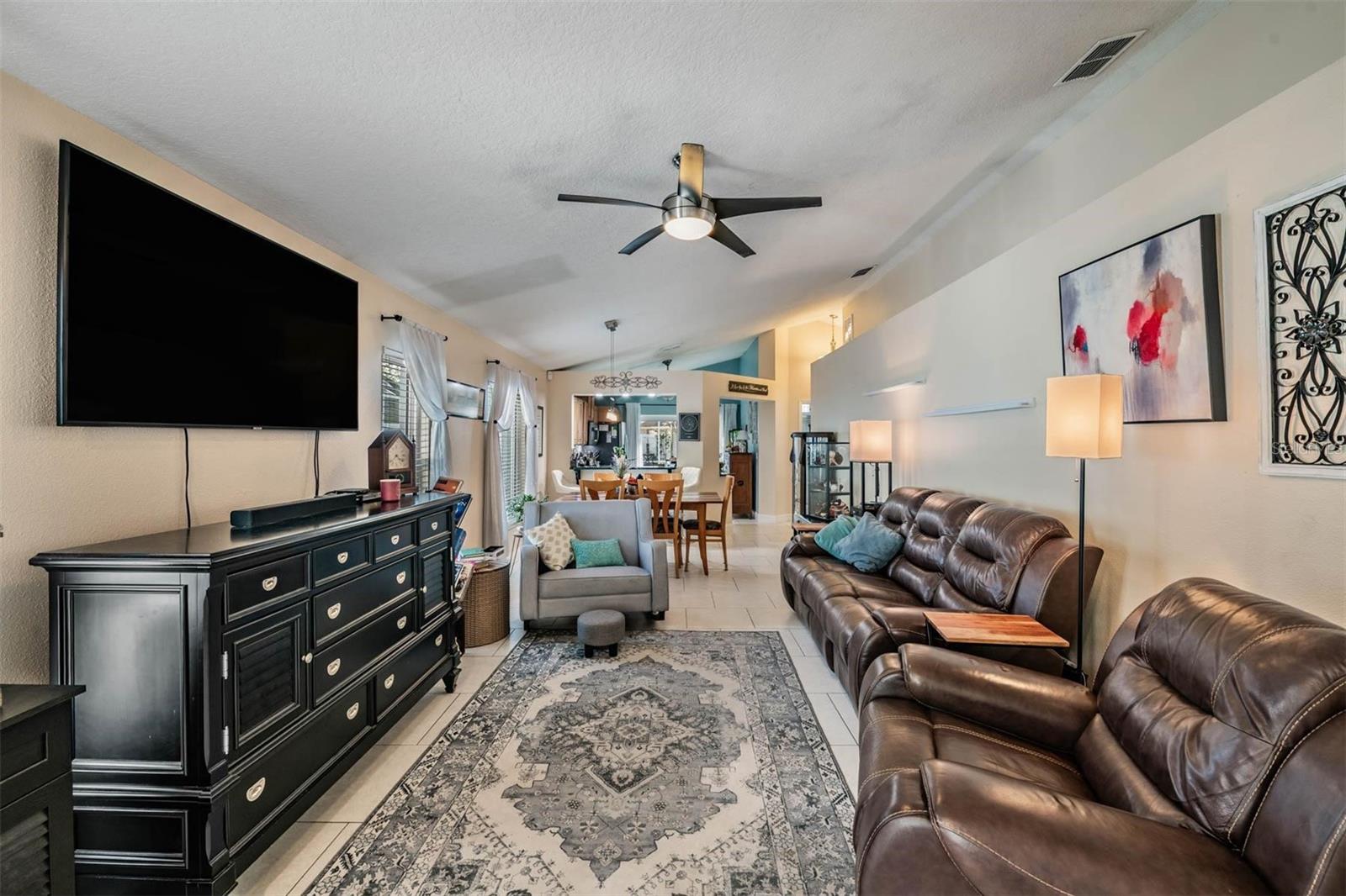 Living Room/Dining area with vaulted ceilings