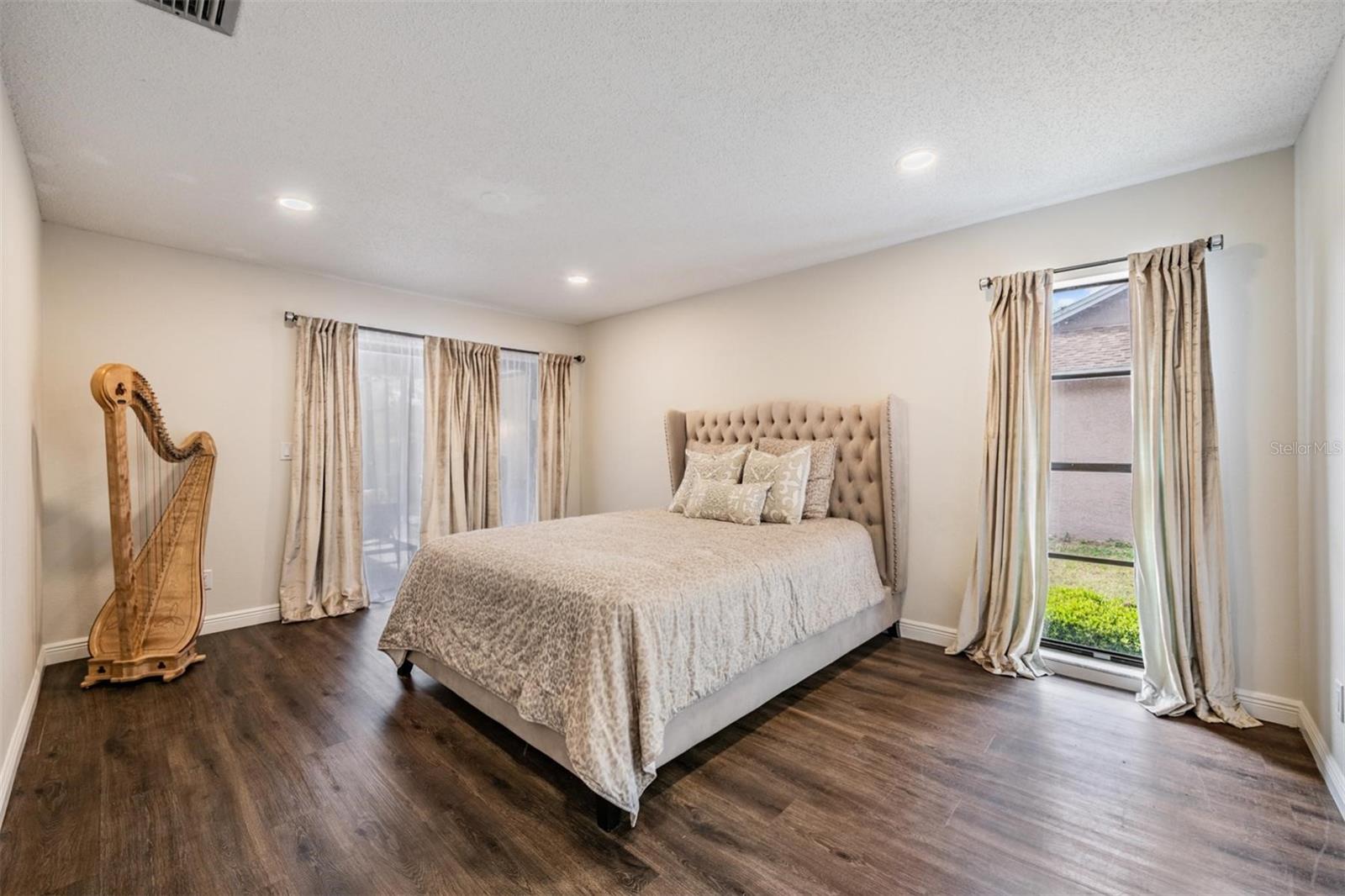 Primary Bedroom - Lots of windows & natural sunlight
