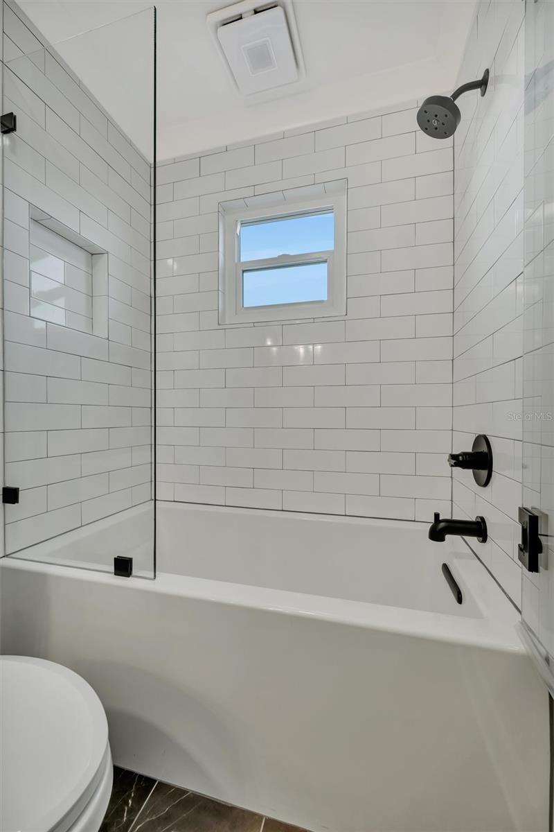 The guest bathroom upstairs in the hallway