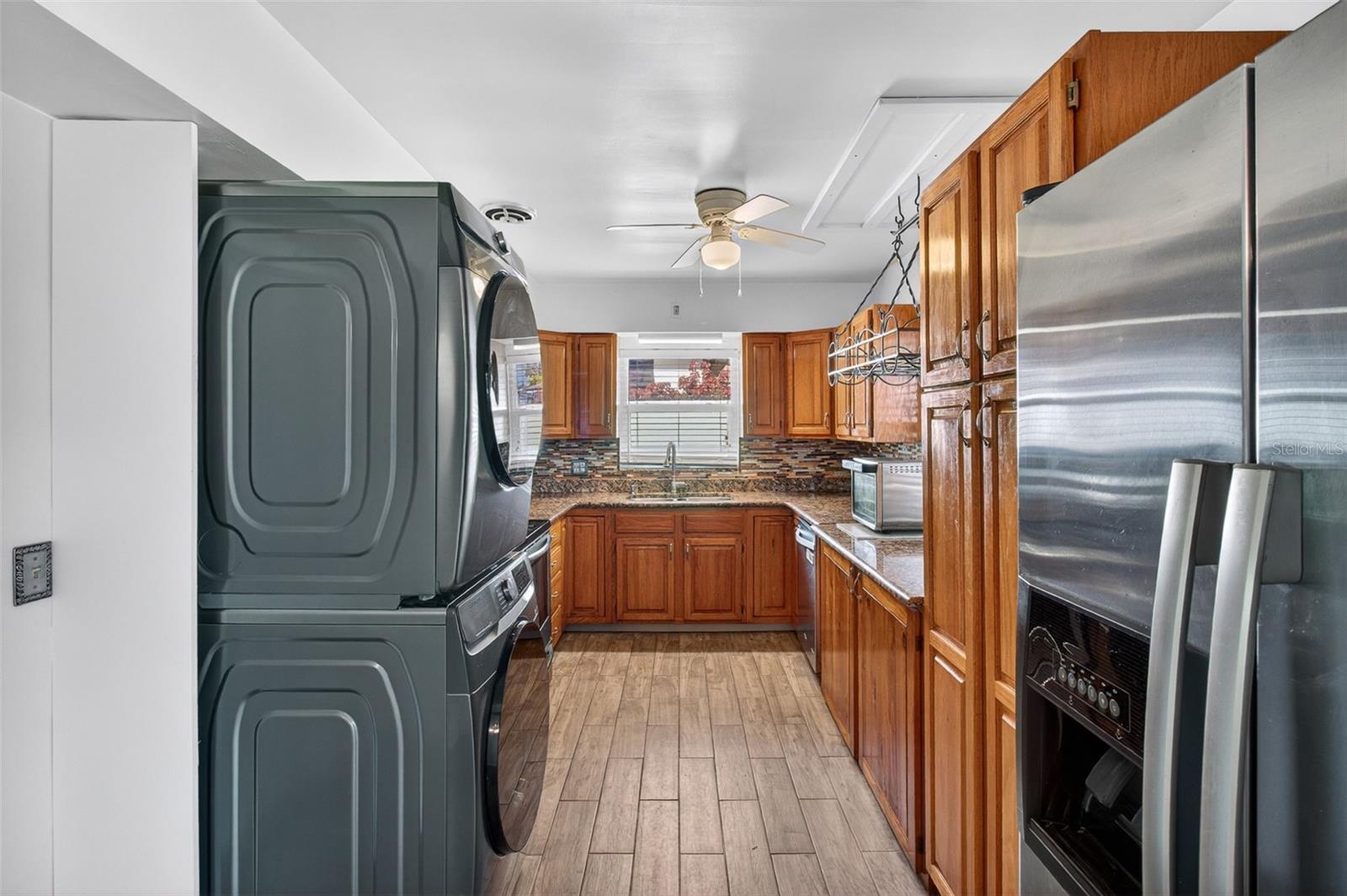 Spacious Kitchen includes many cabinets, pantry cabinet, stainless steel appliances and has space for washer/dryer