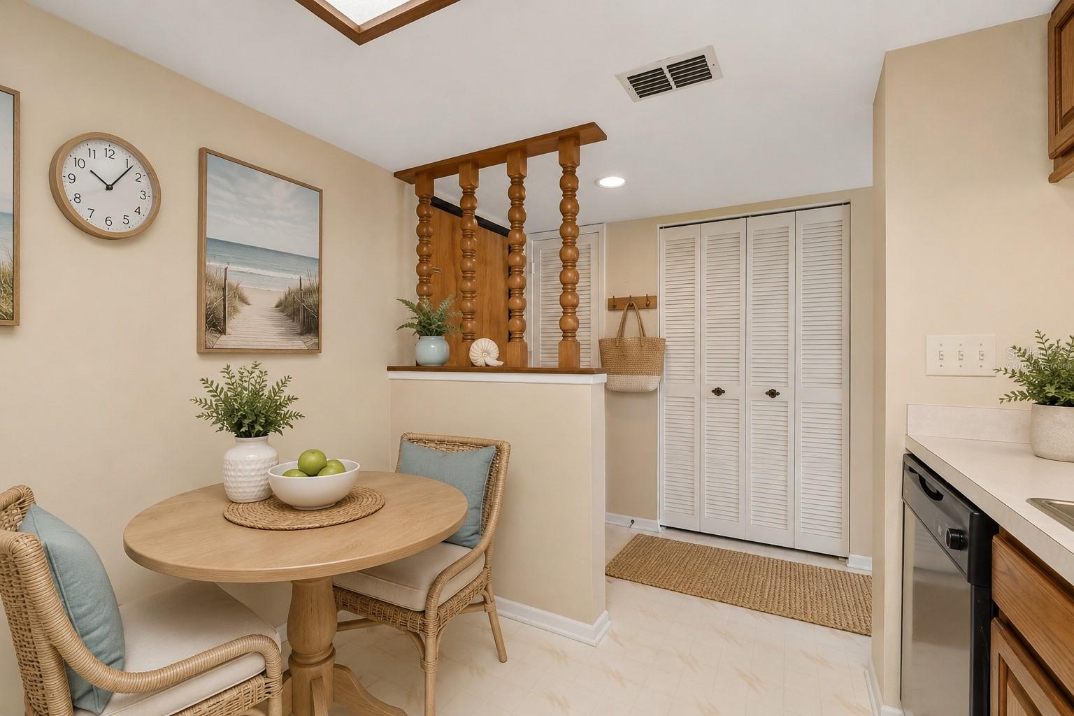 Kitchen with bistro seating, virtually staged
