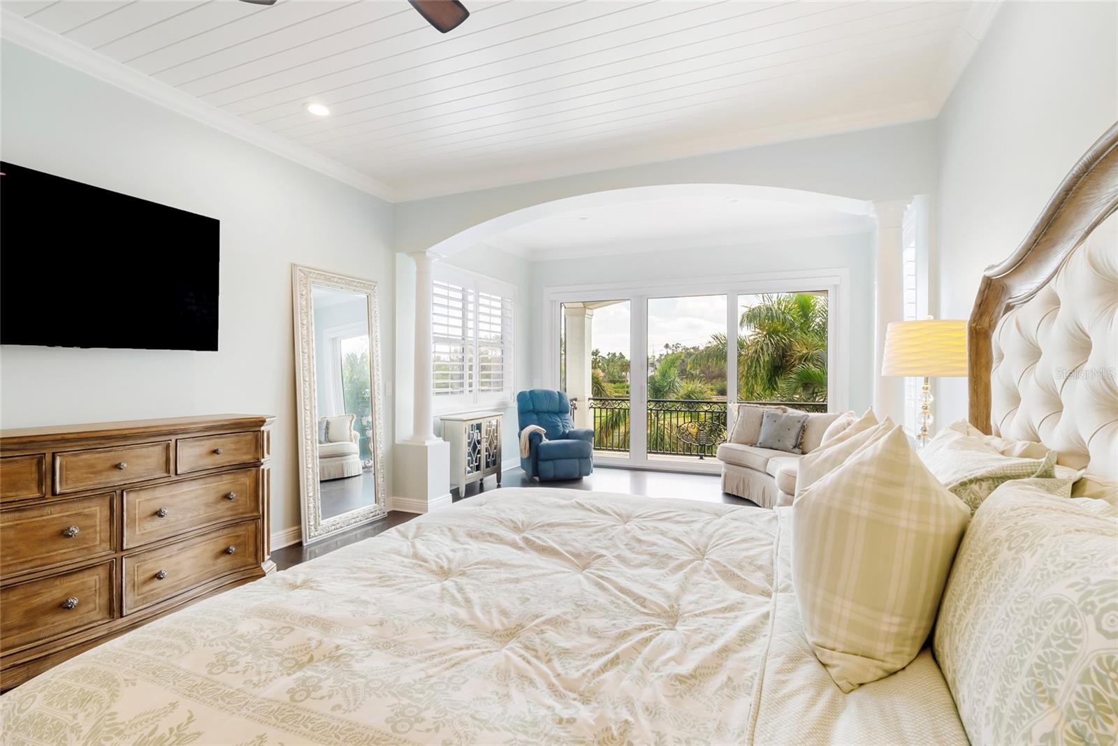 Primary suite with sitting area and balcony