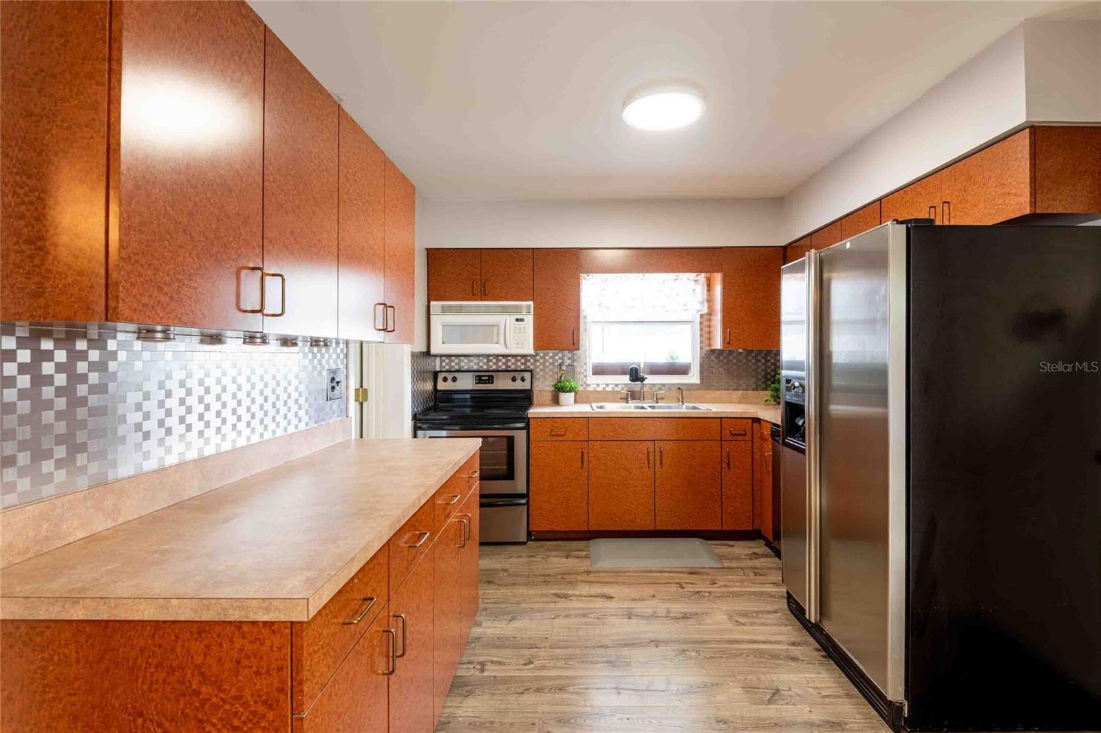 Kitchen with lots of cabinets.