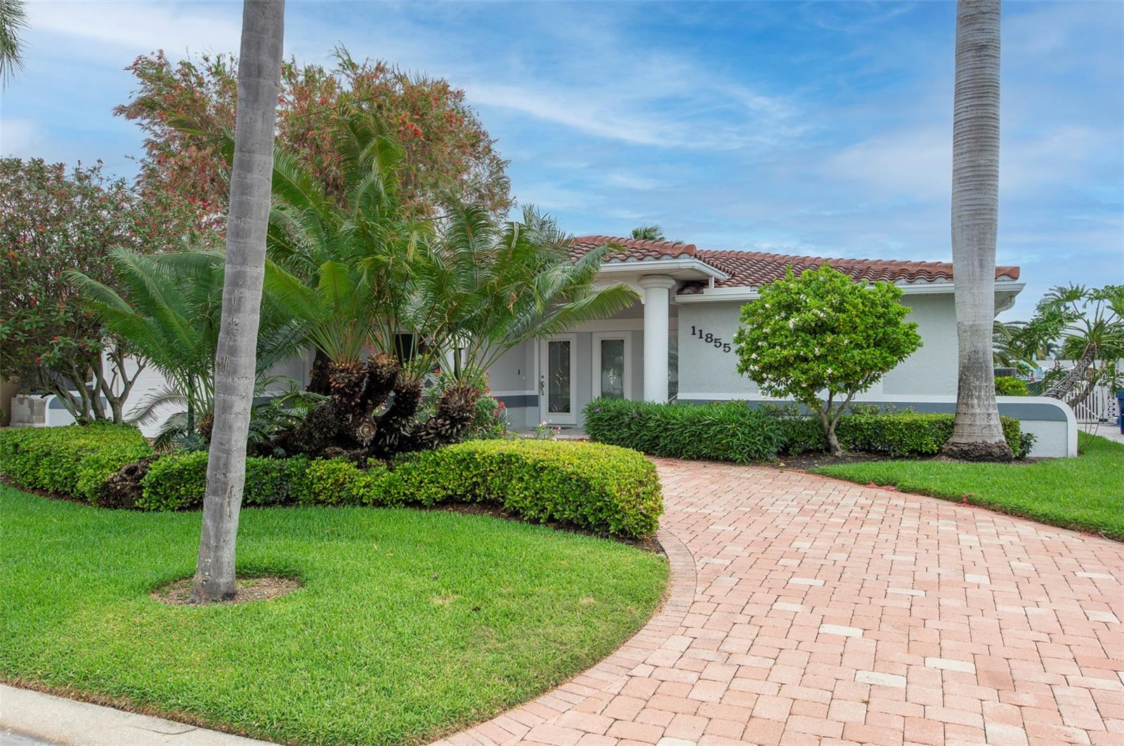 Arrive home on your brick paved circular driveway