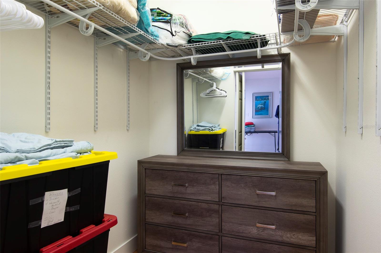 The master bedroom features a spacious walk-in closet