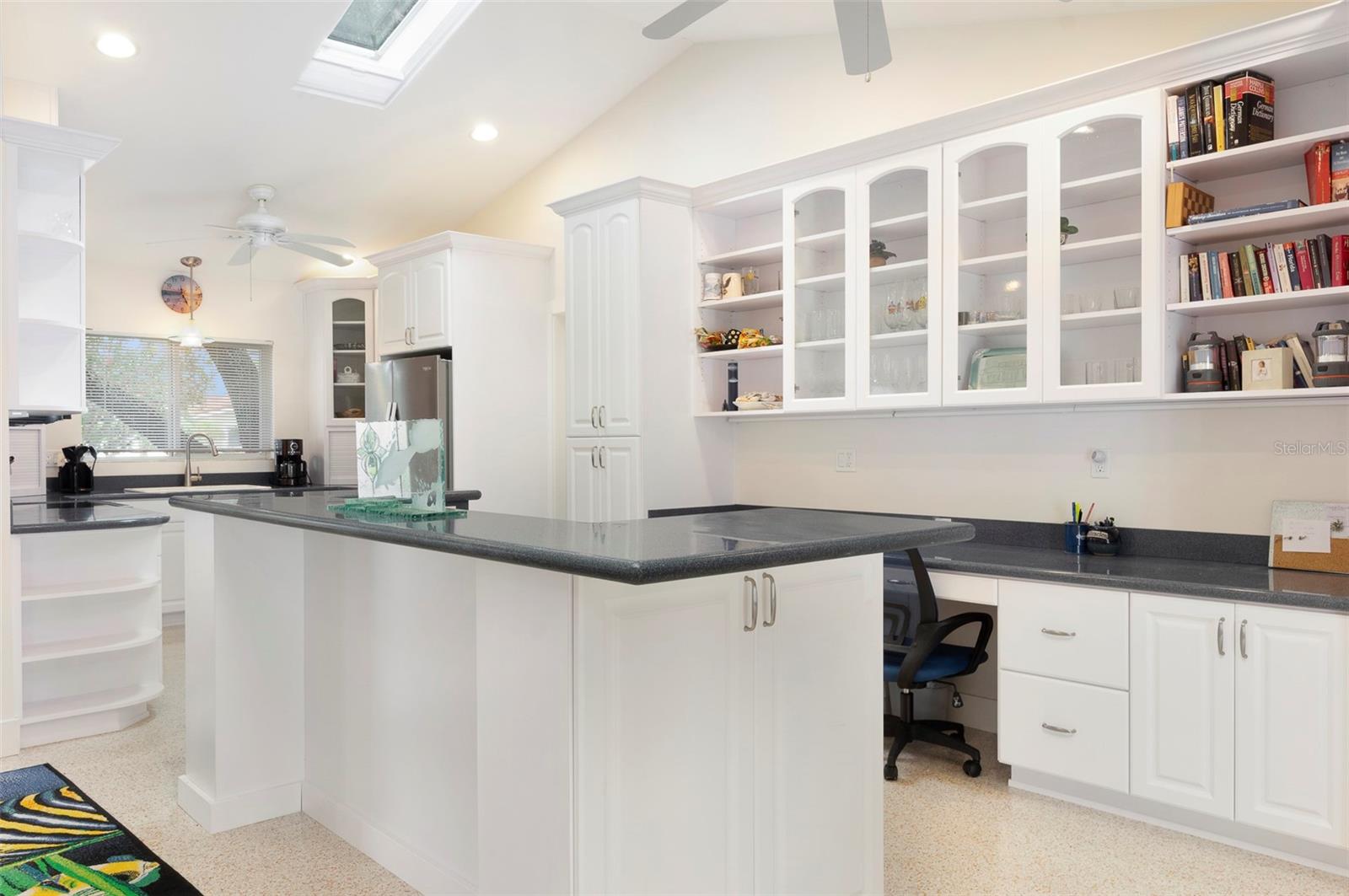 Beautiful solid surface countertops & the additional barstool island can accommodate many guests!