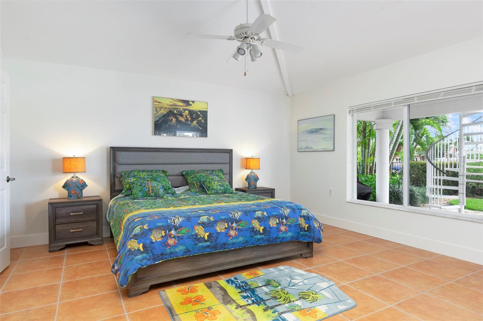 The master bedroom boasts the same spacious tall ceilings & ample natural light