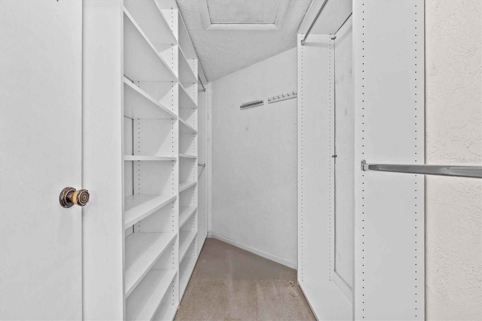 Walk-in closet in primary suite provides ample storage