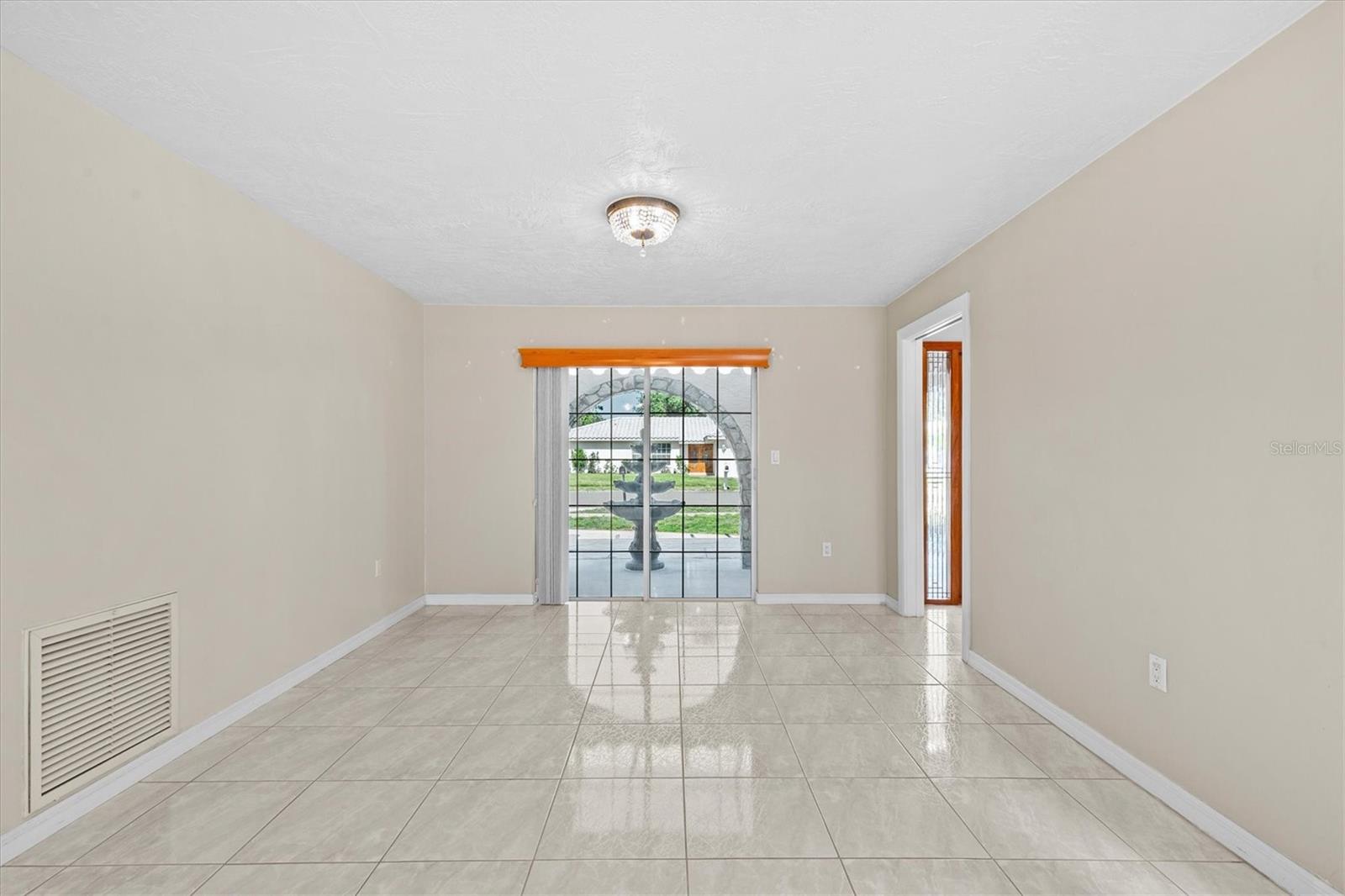 Versatile space offers endless possibilities—perfect for a formal dining area, cozy family room, or personalized living setup