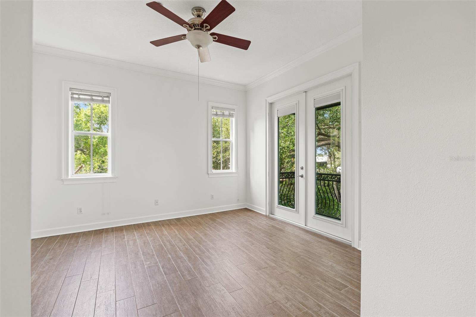 Owners suite with French doors and balcony