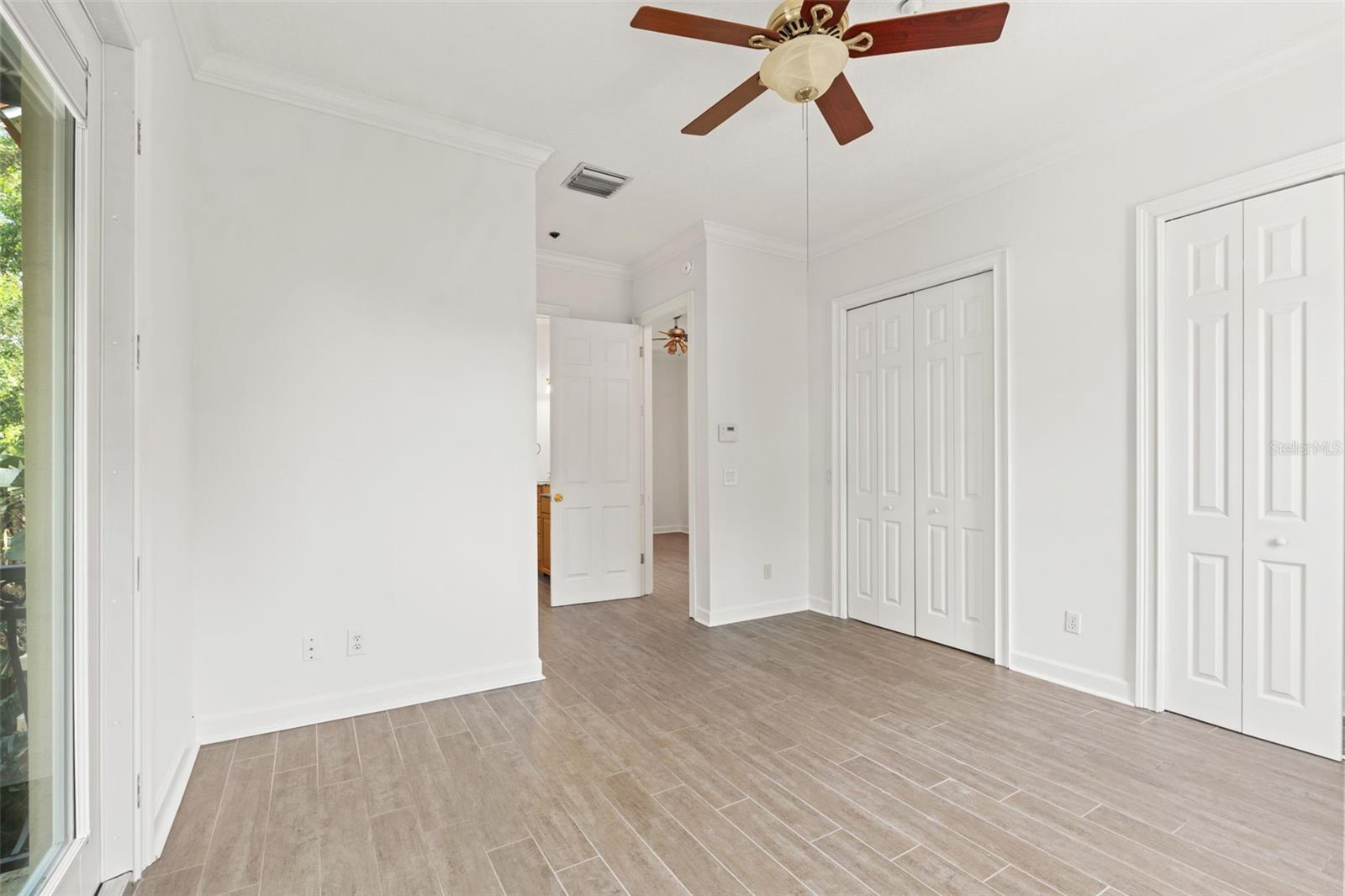 Primary bedroom with dual closets